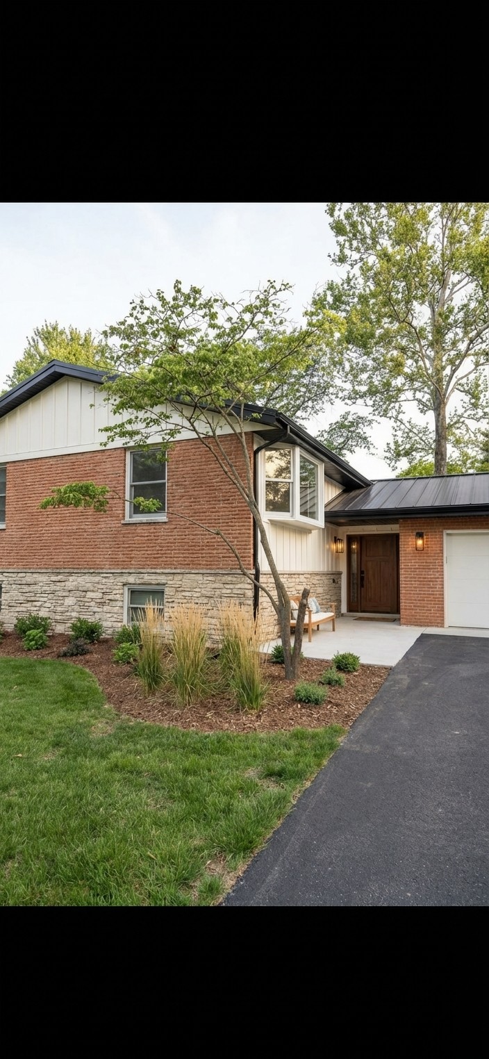 Modern farmhouse. Warm white board-and-batten, walnut wood door, black metal accents, ornamental grasses.