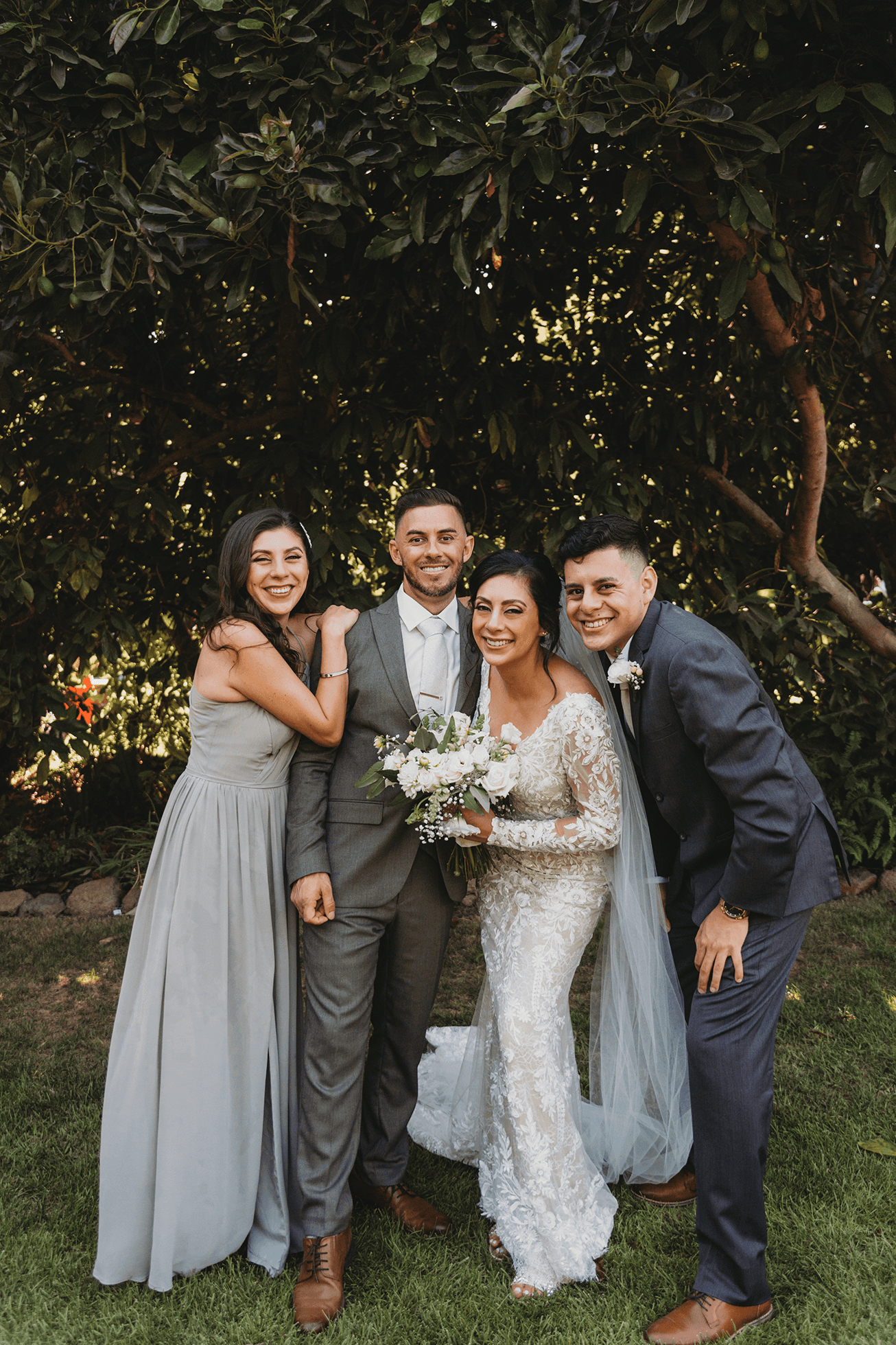 Flat lay wedding details with bouquet, rings, and sparkling bridal heels