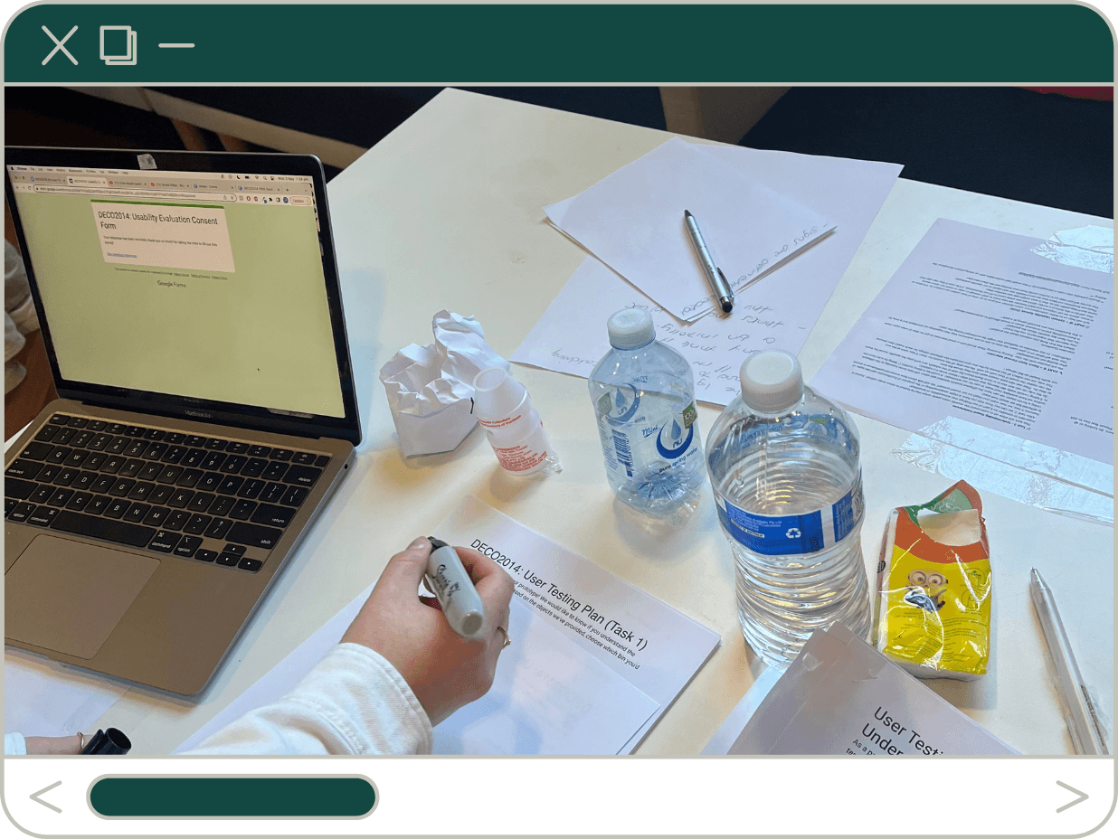 A usability testing setup with a laptop, printed consent forms, water bottles, snacks, and handwritten notes.