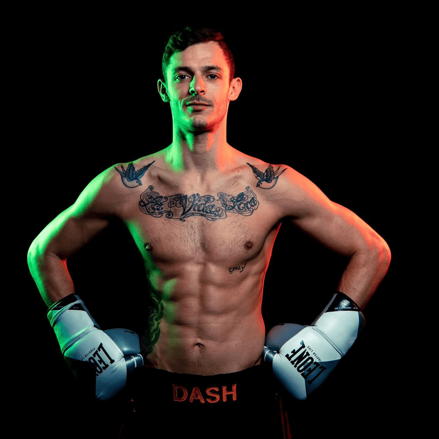 Studio portrait of Danilo Dash Creati wearing gloves and posing confidently.