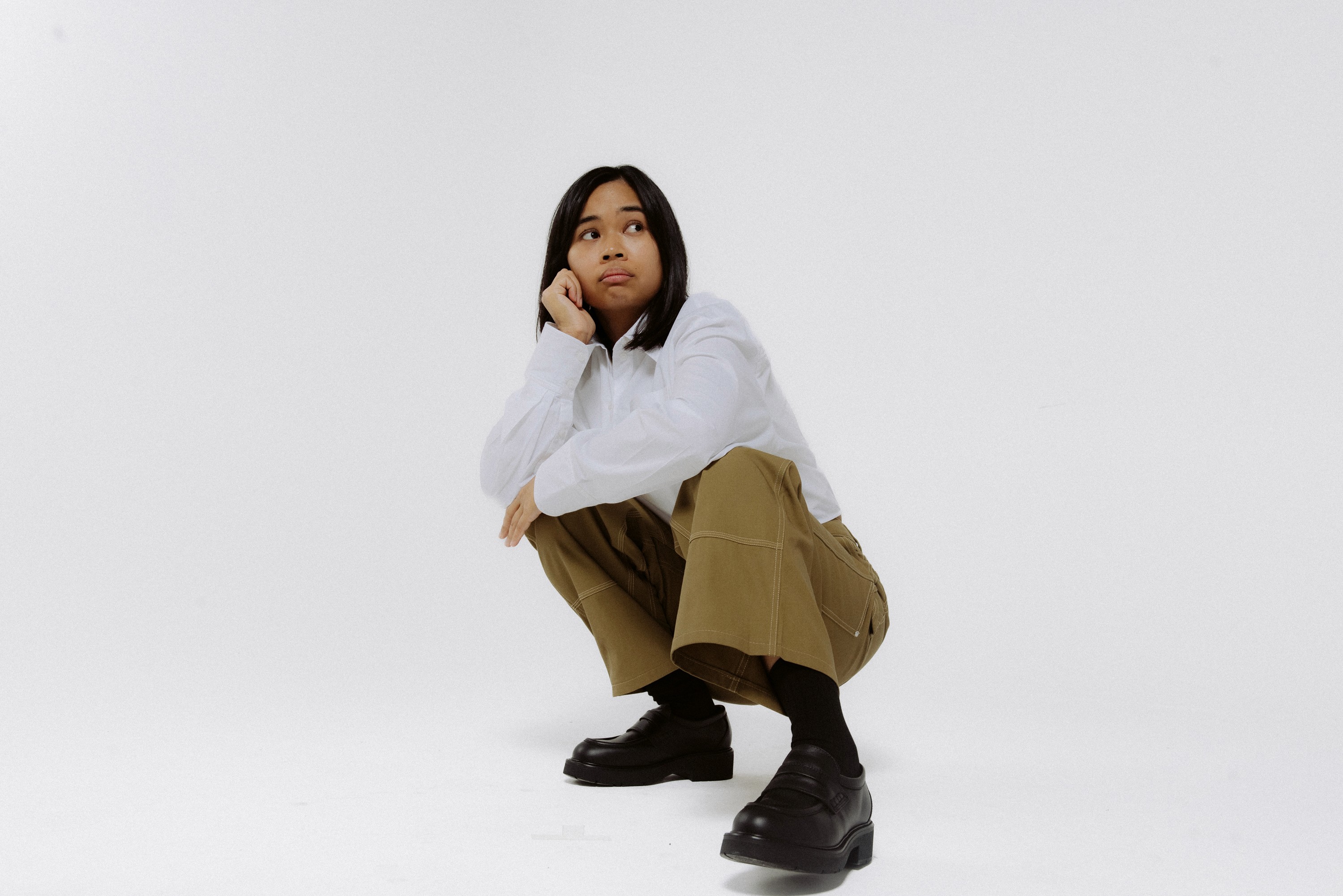 a blurry photo of a person standing in front of a wall