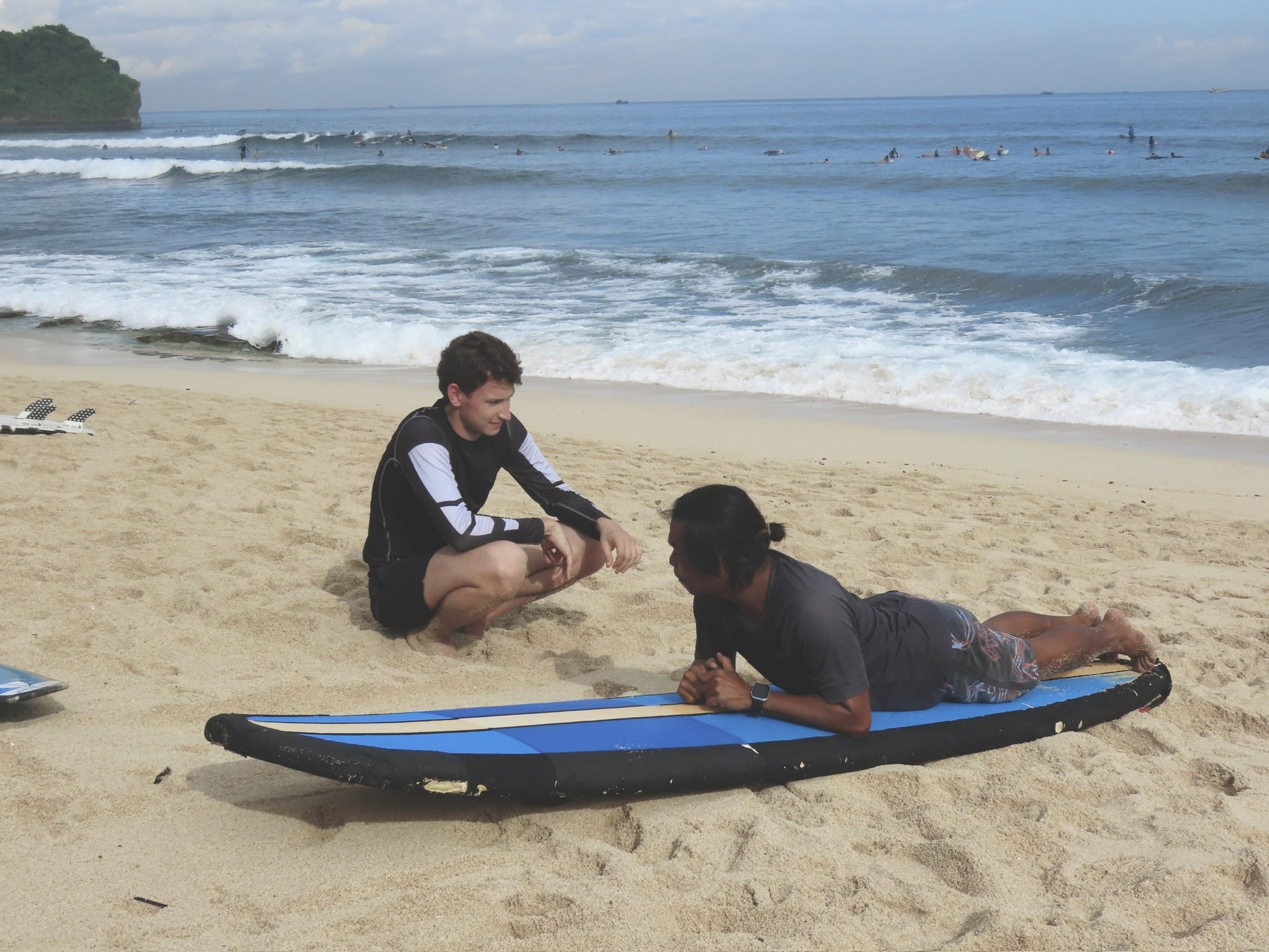 A man with surfboard