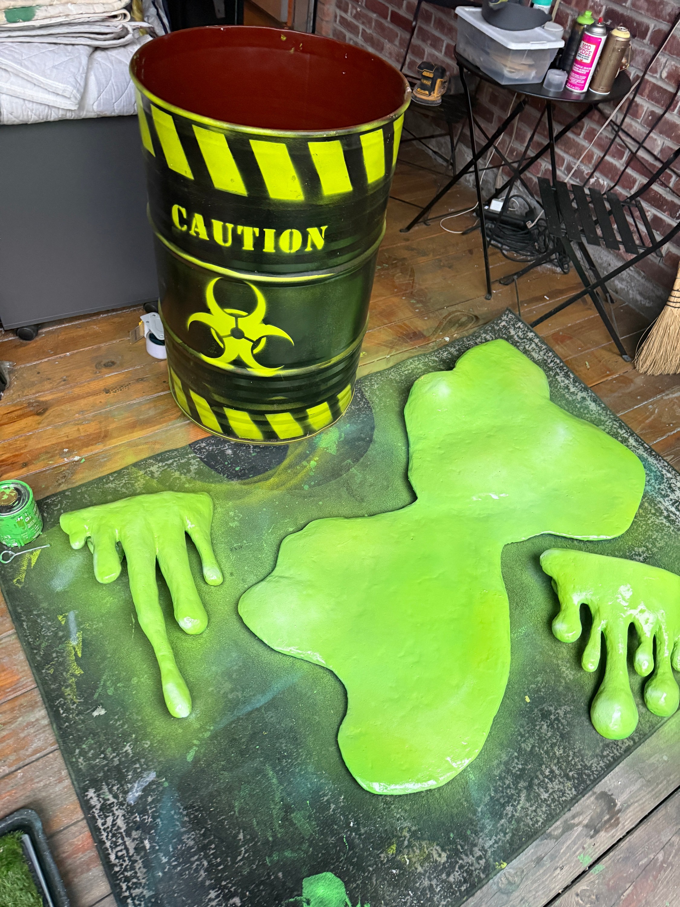 Fabricated barrel, hands, and green spill props in the workshop for KATiiE’s Fallout EP release