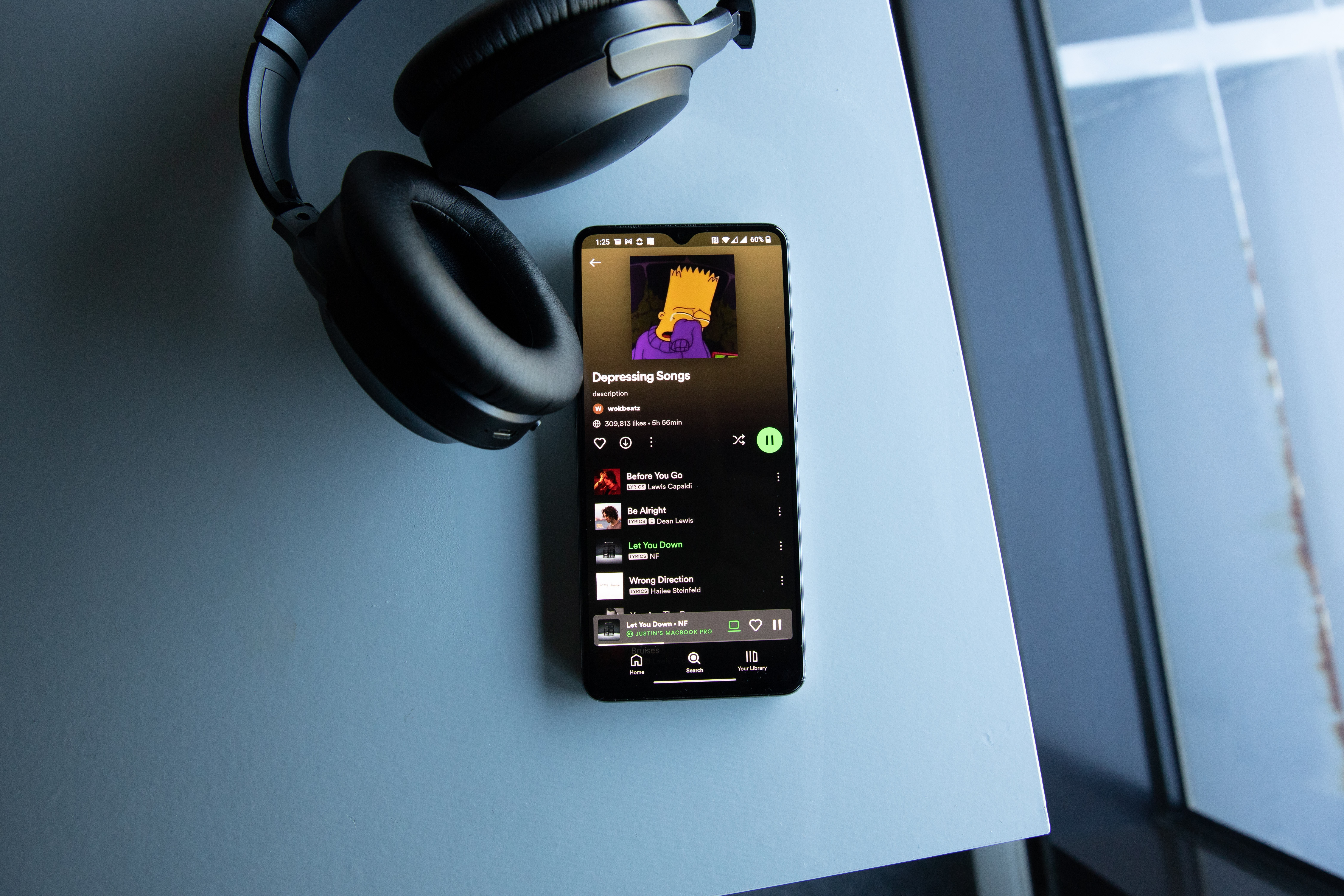 phone playing an album with headphones - how to make your own song 