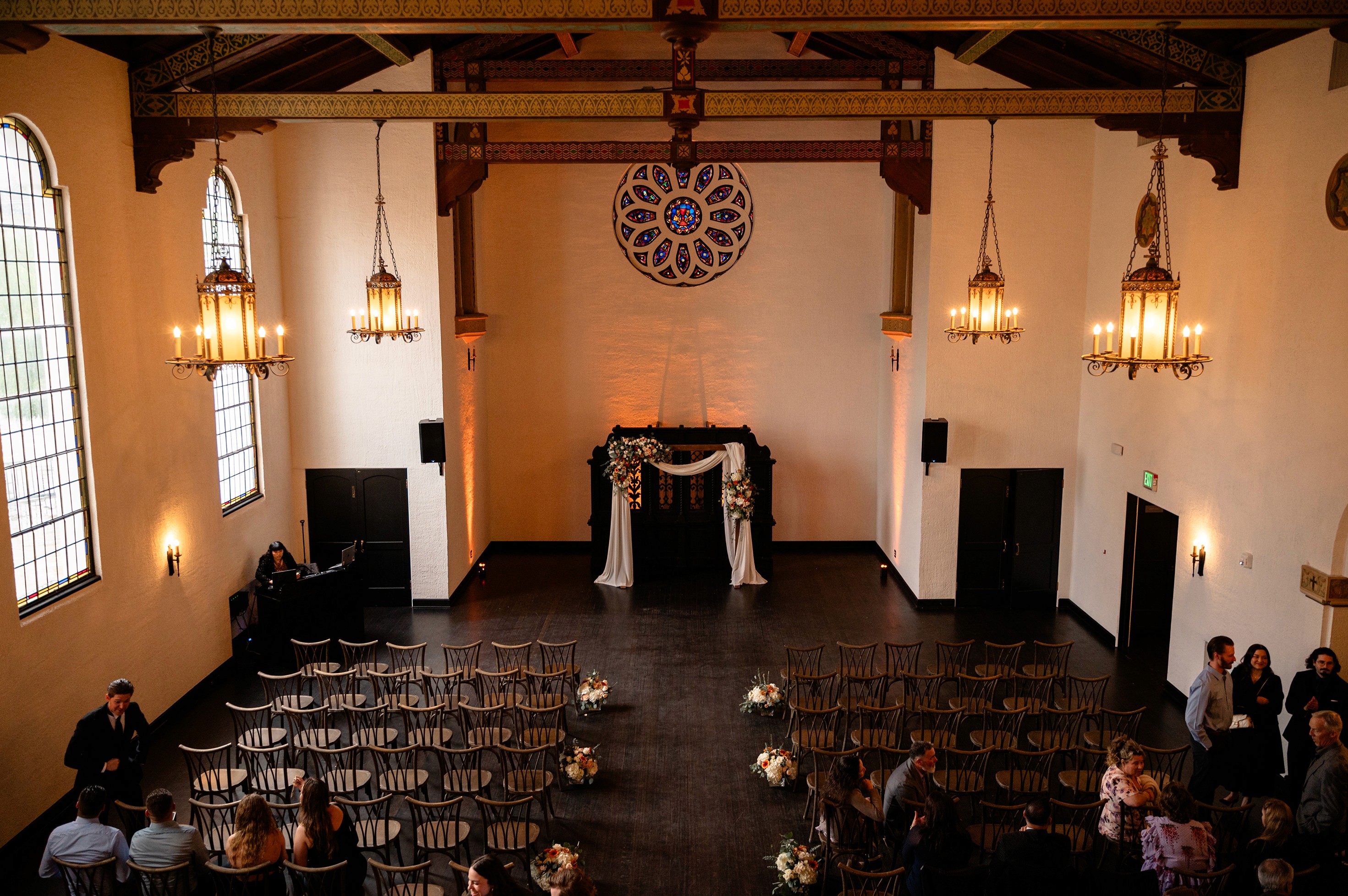 Flat lay wedding details with bouquet, rings, and sparkling bridal heels
