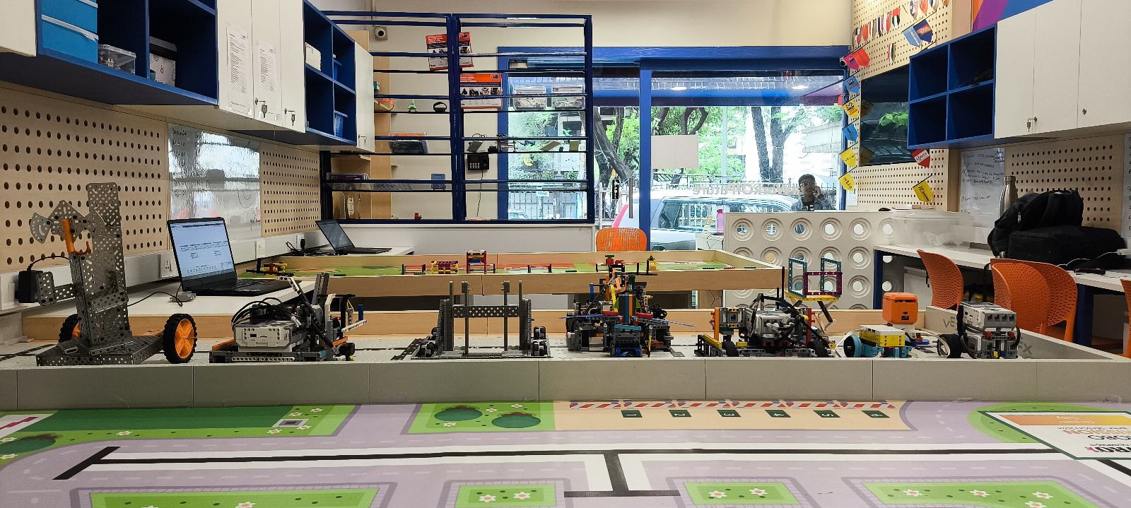 green chairs under umbrellas on shore