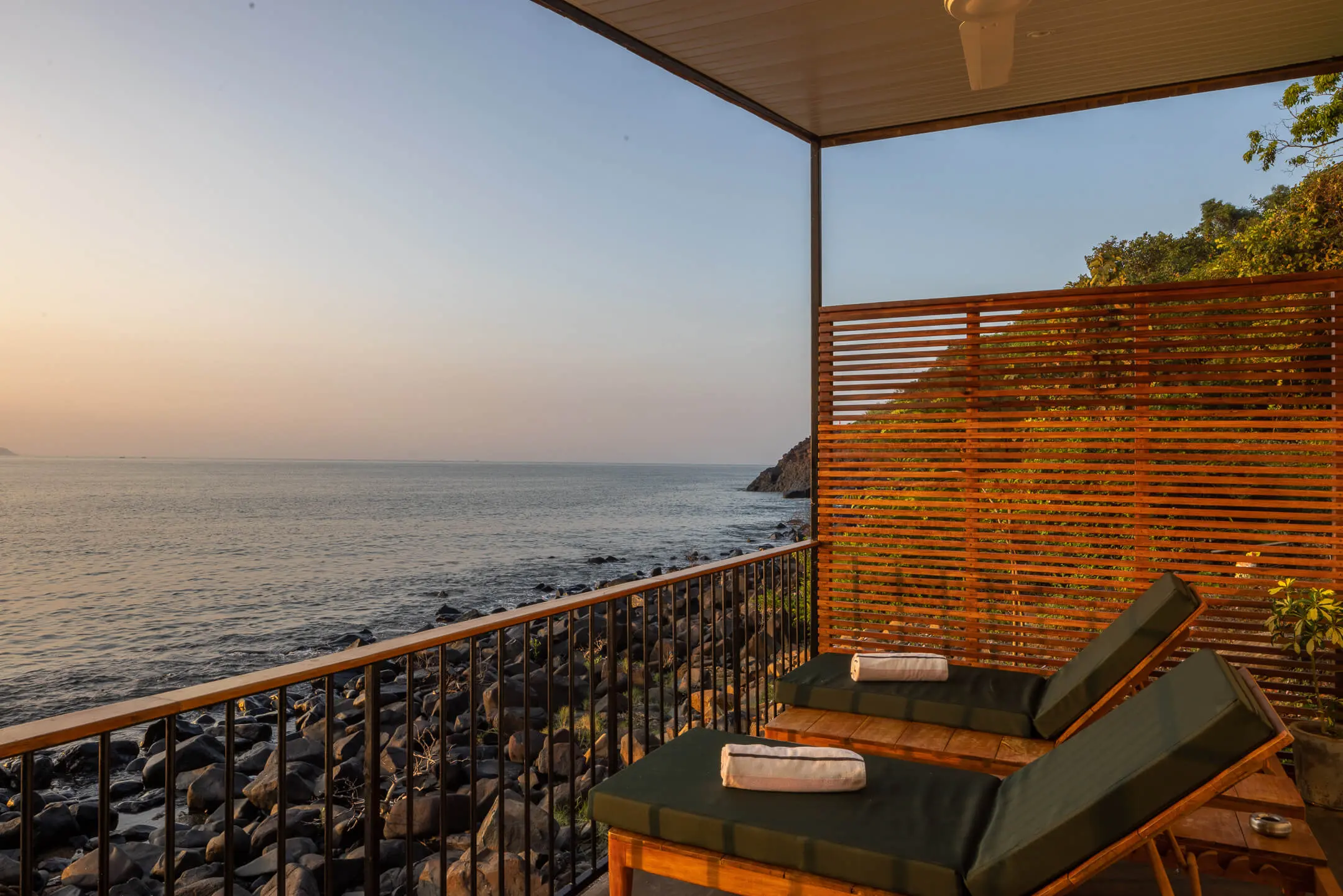 Grand Sea View Room 9 at Casa Jaali — dusk over the bay from the balcony