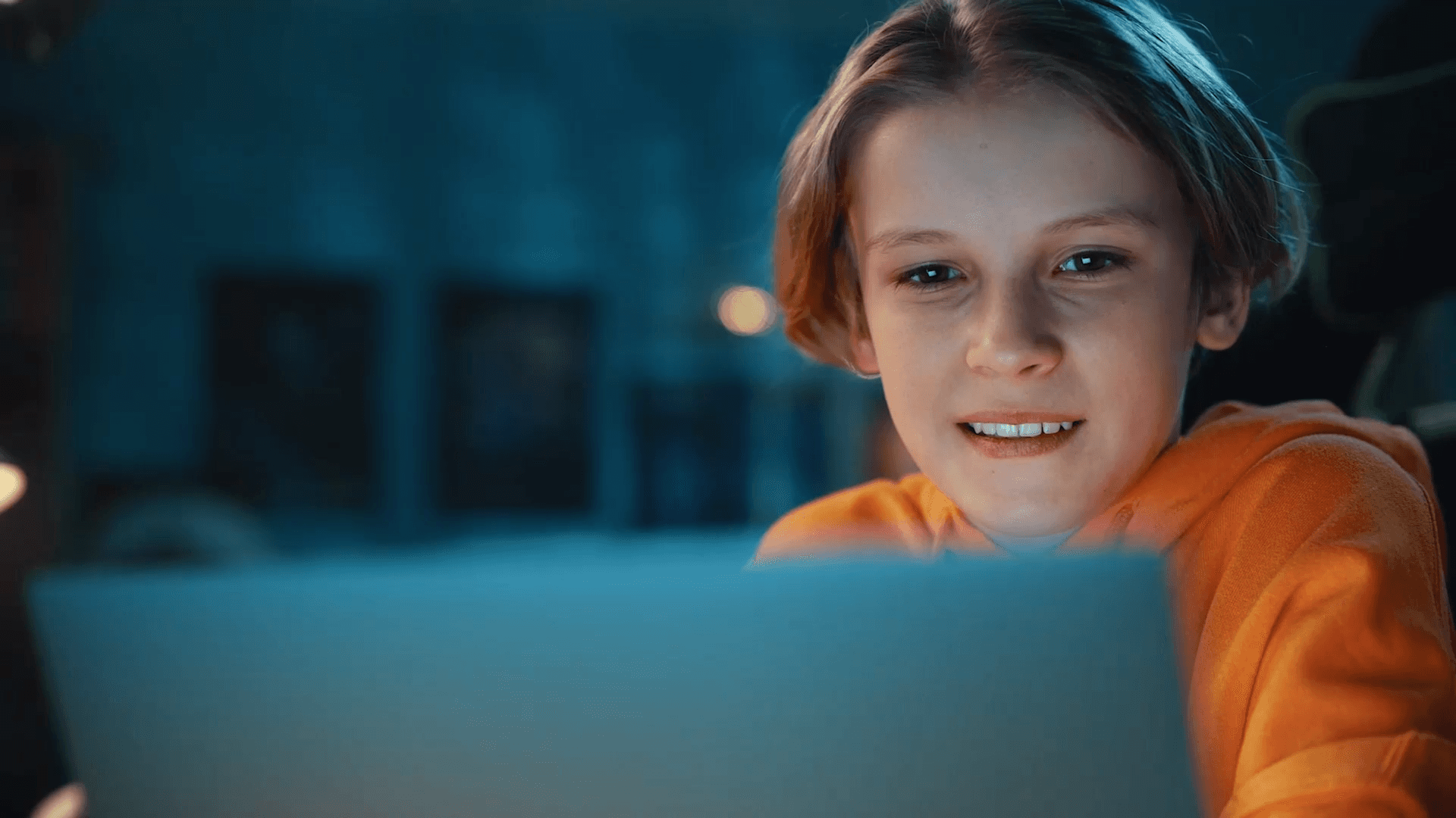 a group of children sitting at desks in a classroom
