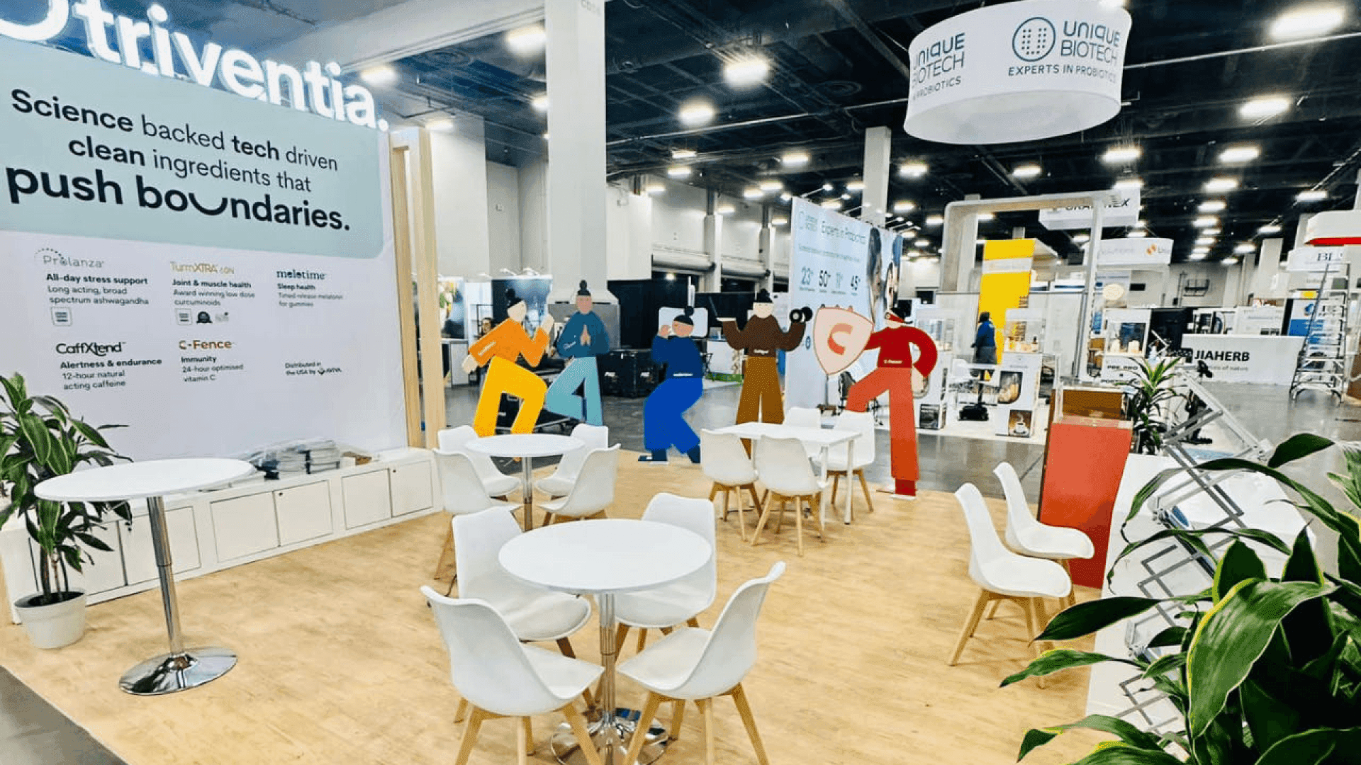 CPG exhibit booth featuring organized product merchandising and buyer conversation space for Expo West exhibitors