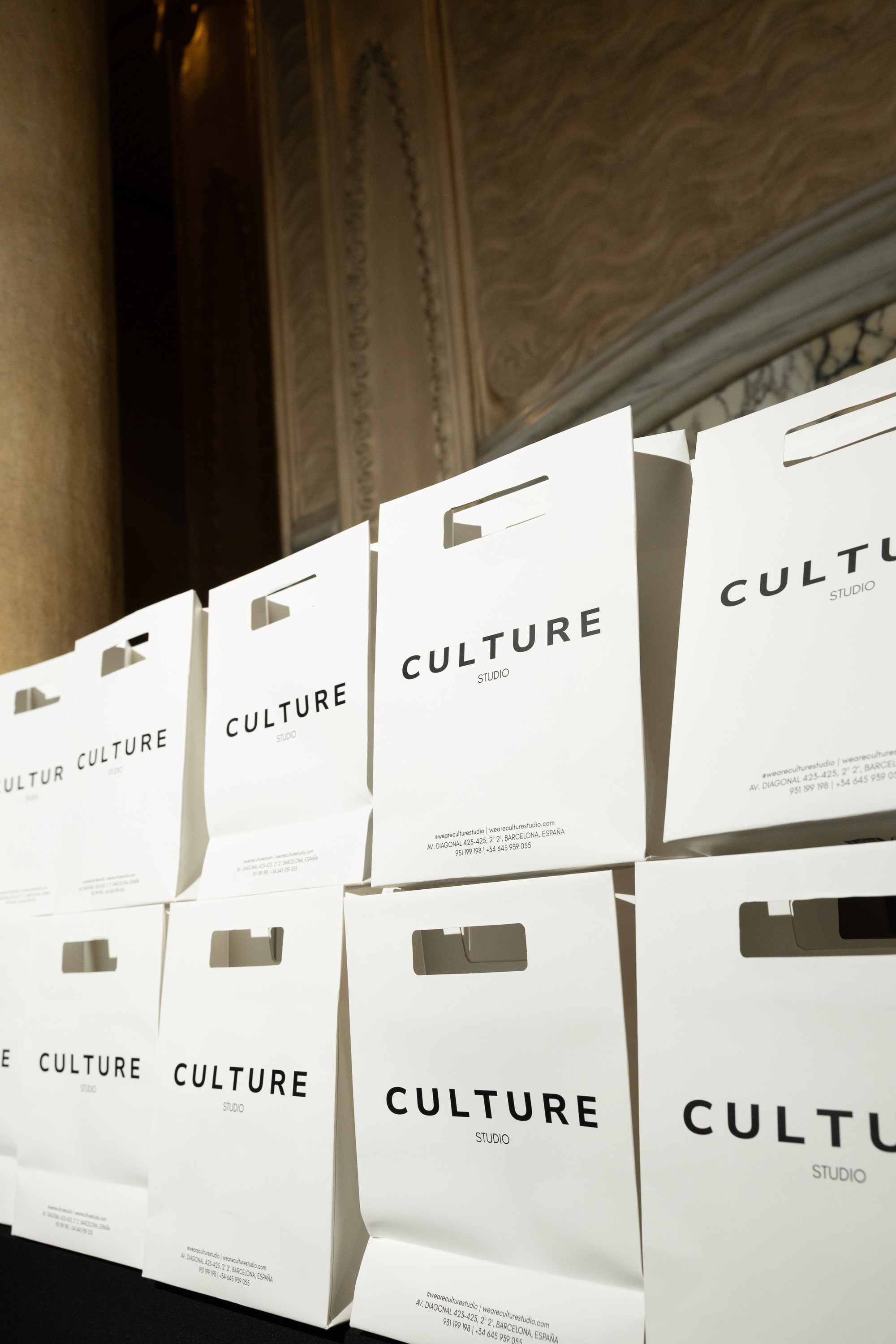 Culture Studio branded tote bags displayed at an event