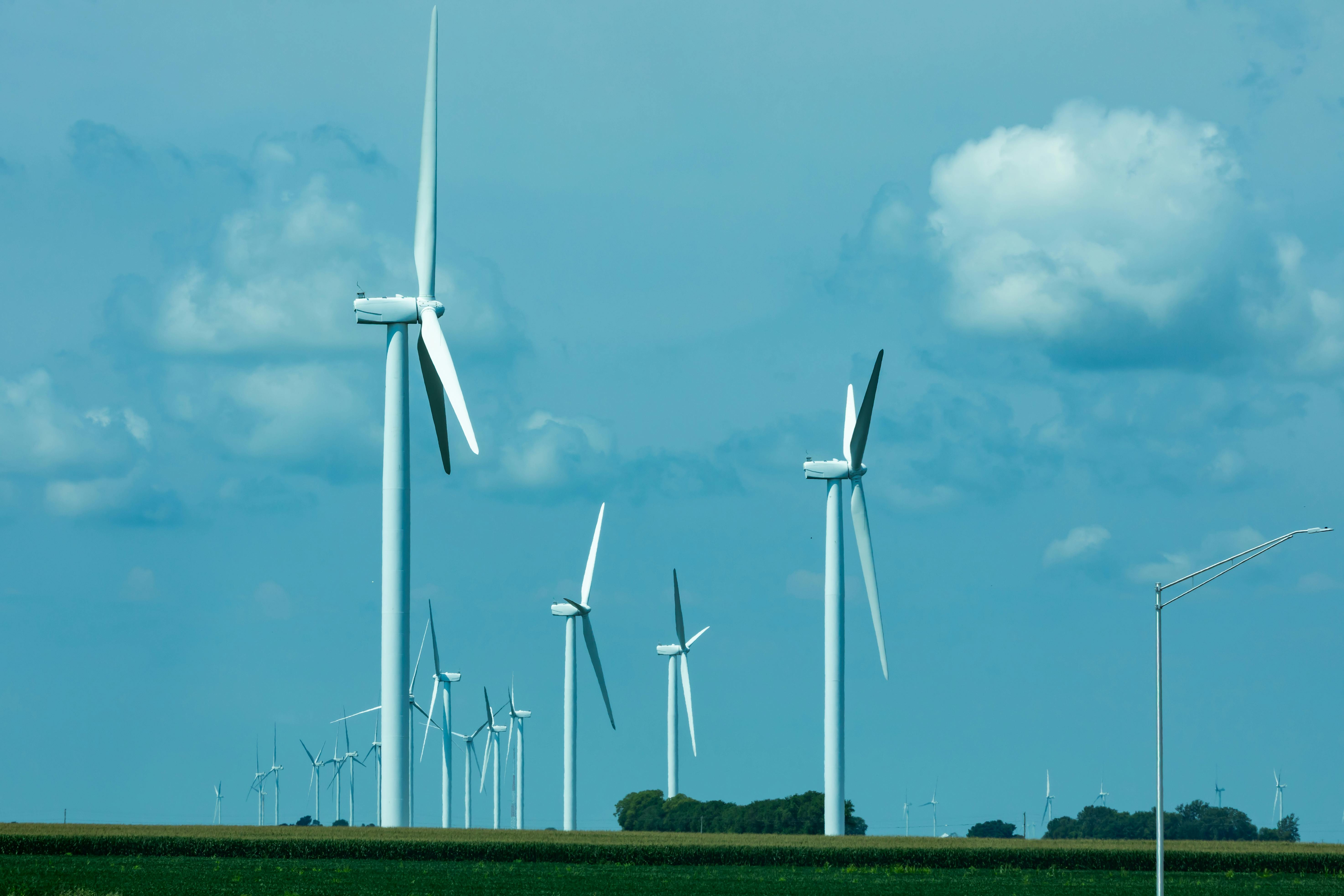 a wind turbine is shown against a blue sky