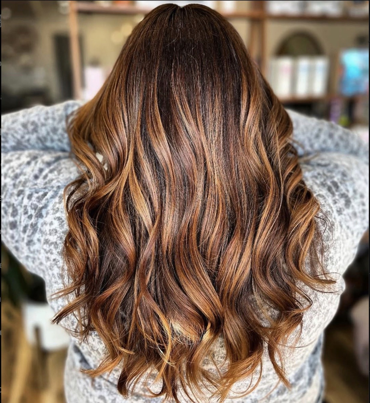 Warm dimensional ginger color melt by Tannya Speir at Del Sol Hair Studio Huntington Beach