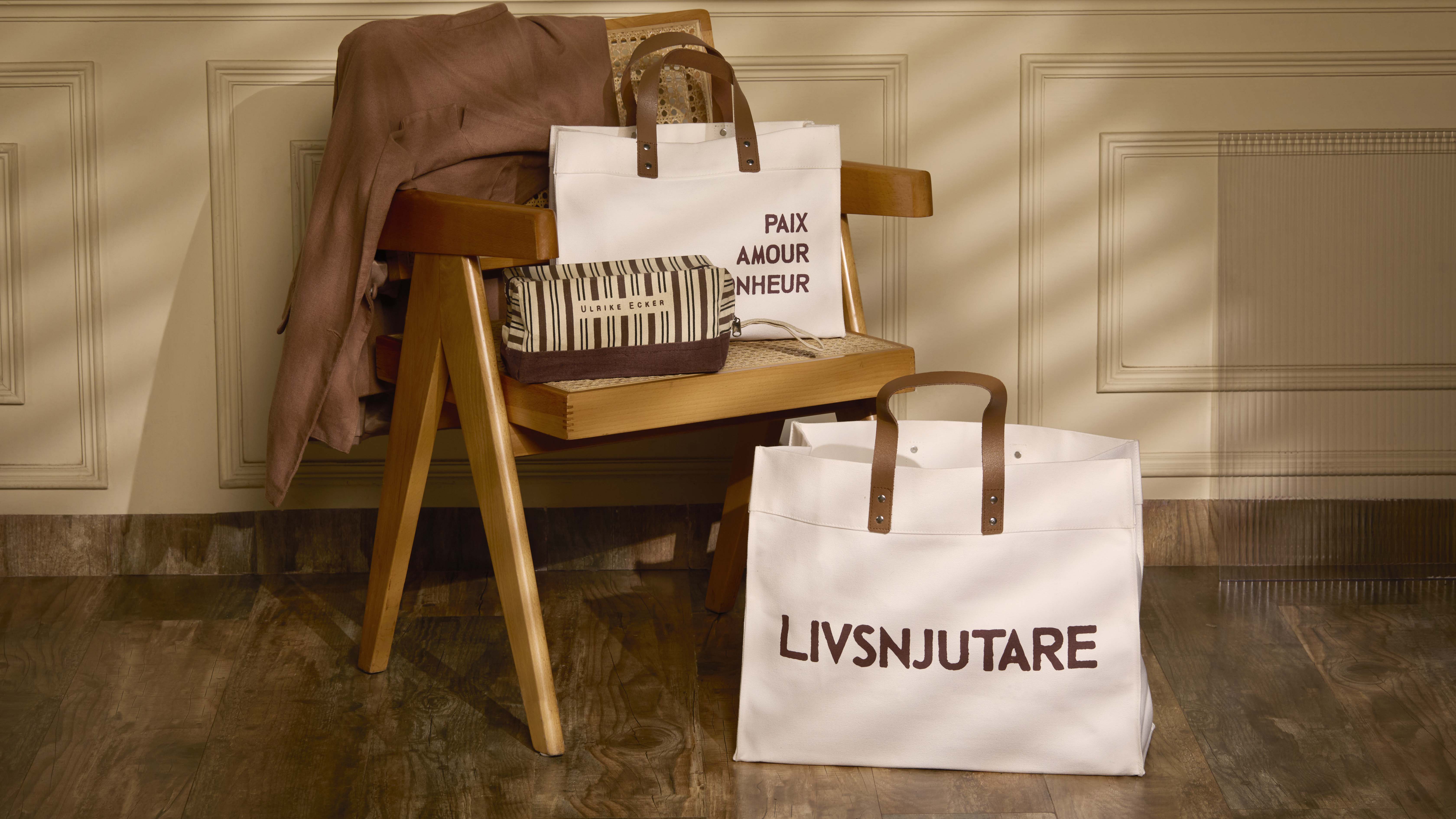 Close-up of a dark green leaf showing its textured surface and central vein against a muted background.