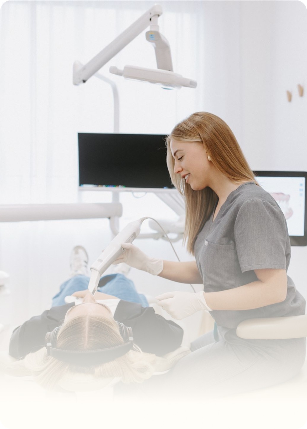 Dental nurse treating patient with care
