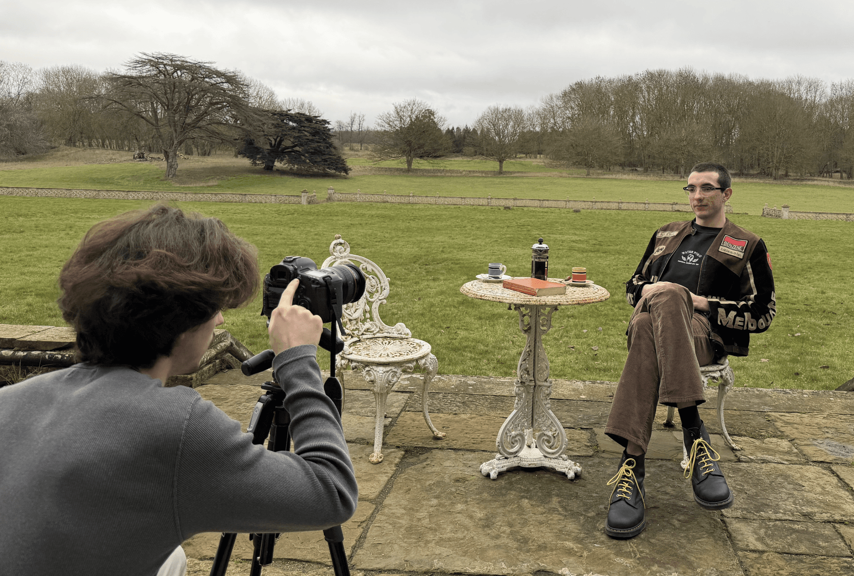 person sitting in a chair in front of a man