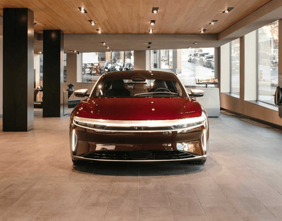 Lucid electric car displayed in a showroom, highlighting the luxury electric vehicle's design and the growing presence of premium electric mobility solutions in Switzerland