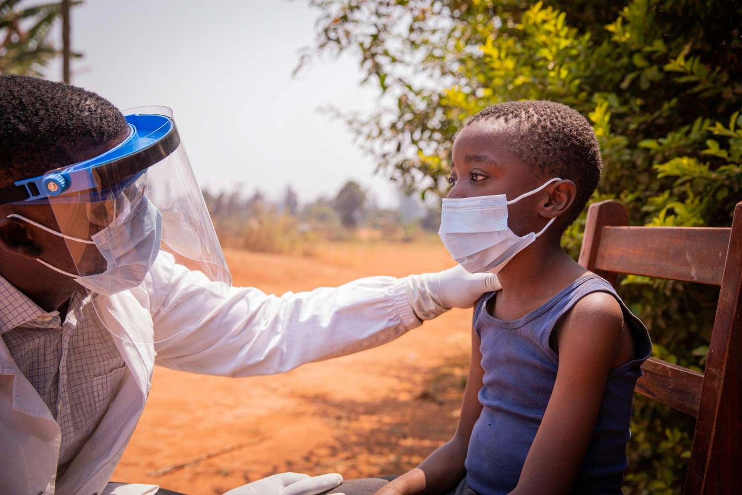 girl in white and pink dress with face mask