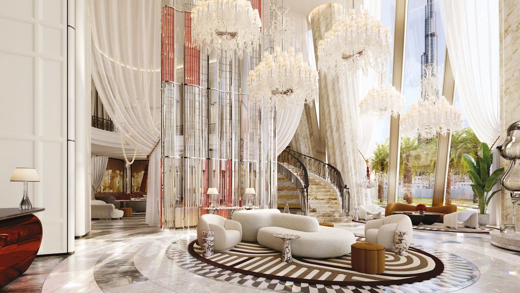 A lavish hotel lobby at Baccarat Residences, Dubai, adorned with stunning chandeliers and sophisticated furnishings. 