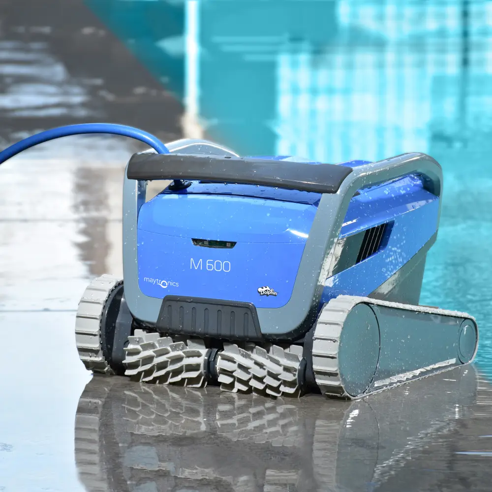 A HD image of the Maytronics roboitc pool cleaner next to a pool