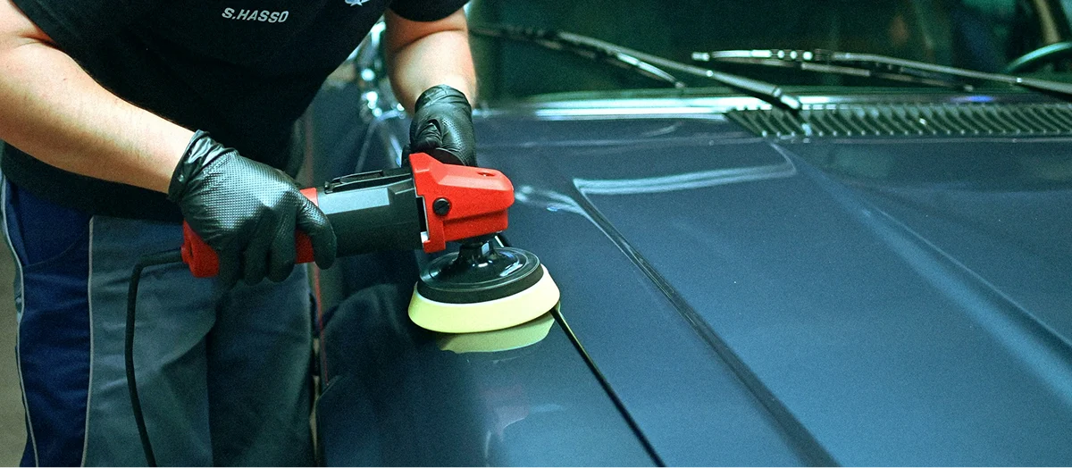 HyperAuto Care Paint Correction service process in a professional auto care workshop