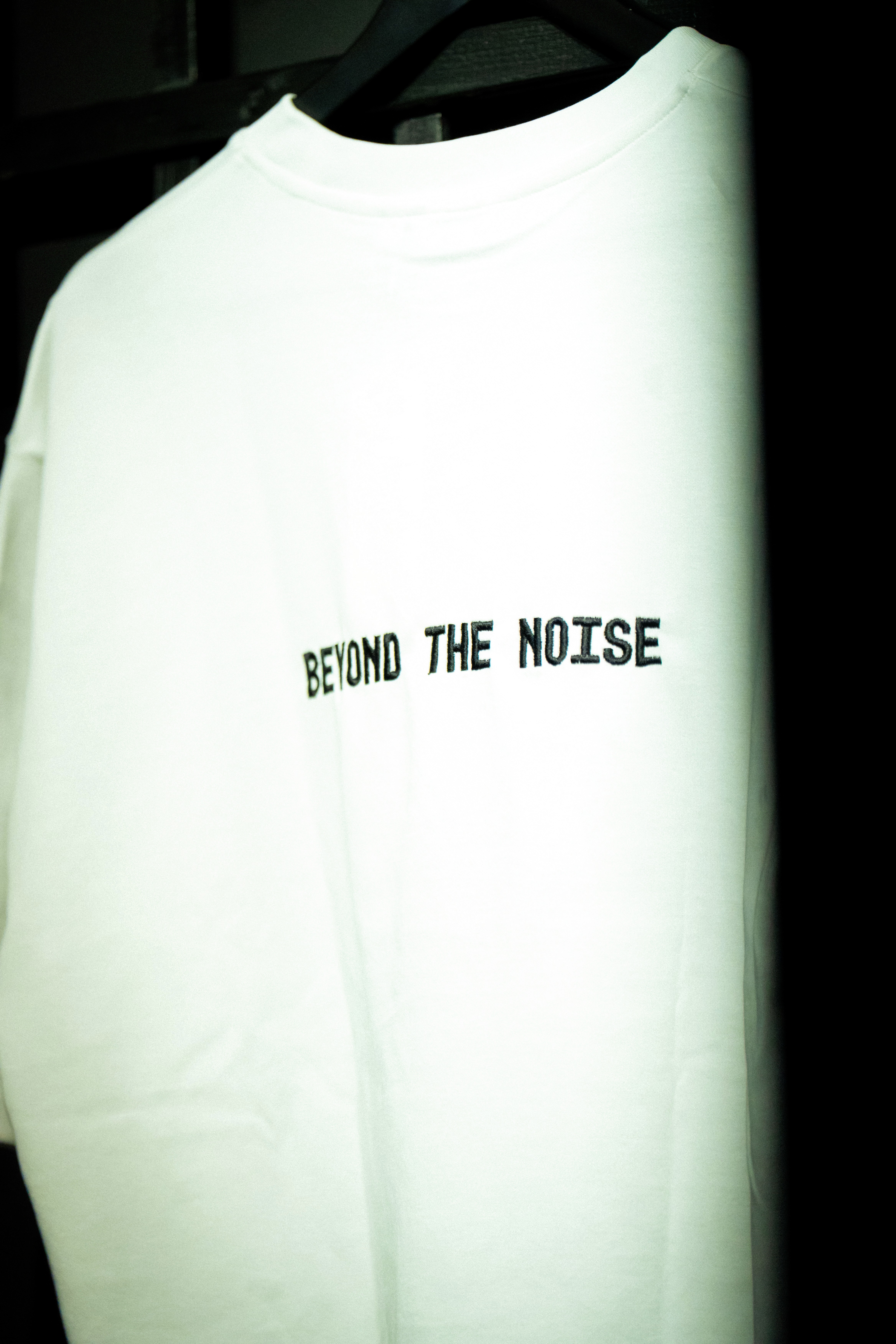 T-Shirt with Text beyon the noise