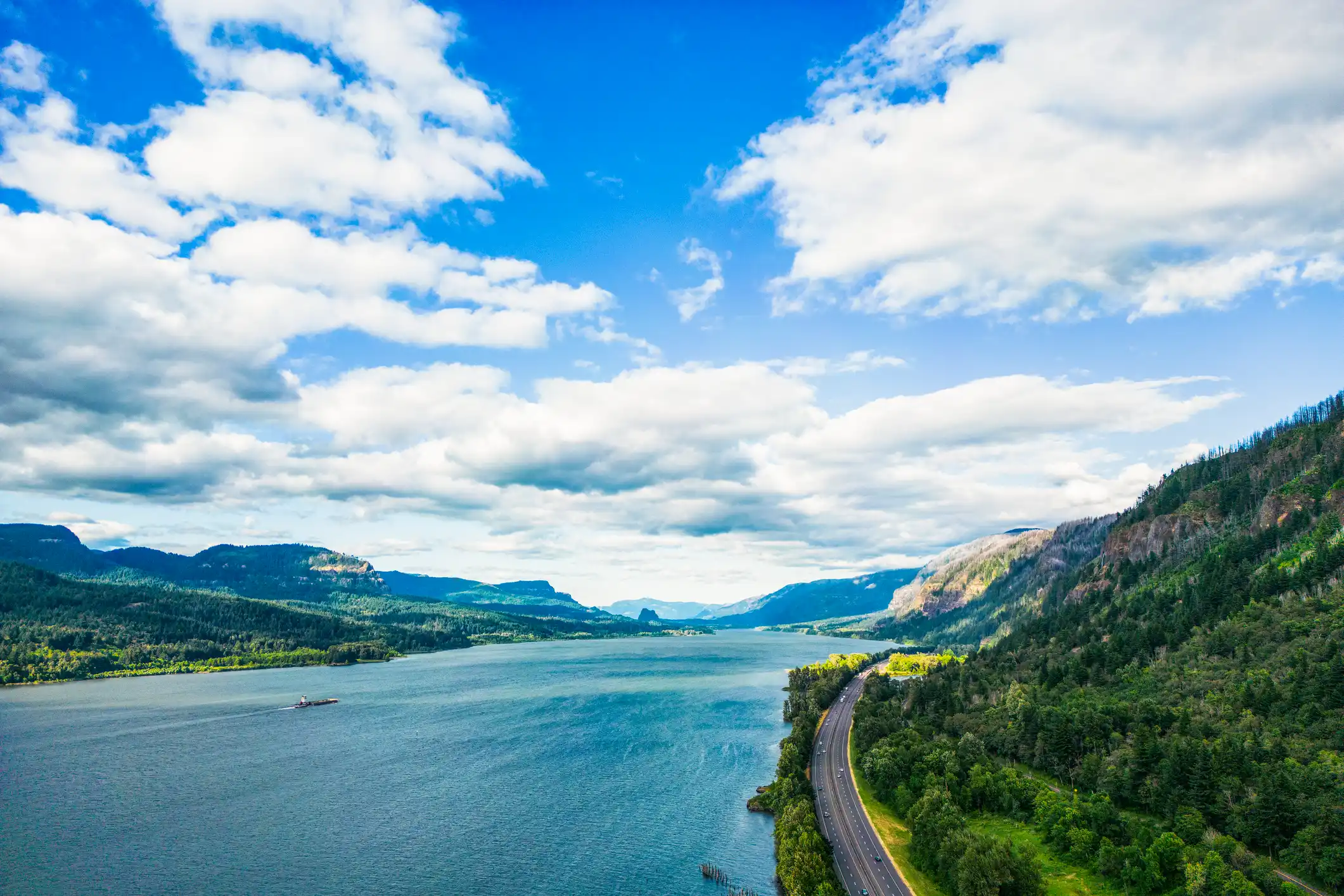 birds eye view of highway beside bay