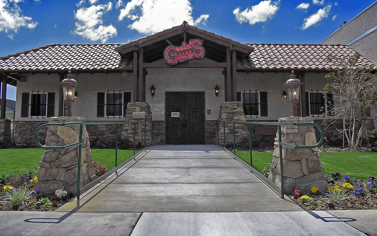 Exterior view of the front entry, highlighting the welcoming entrance with rustic design elements.