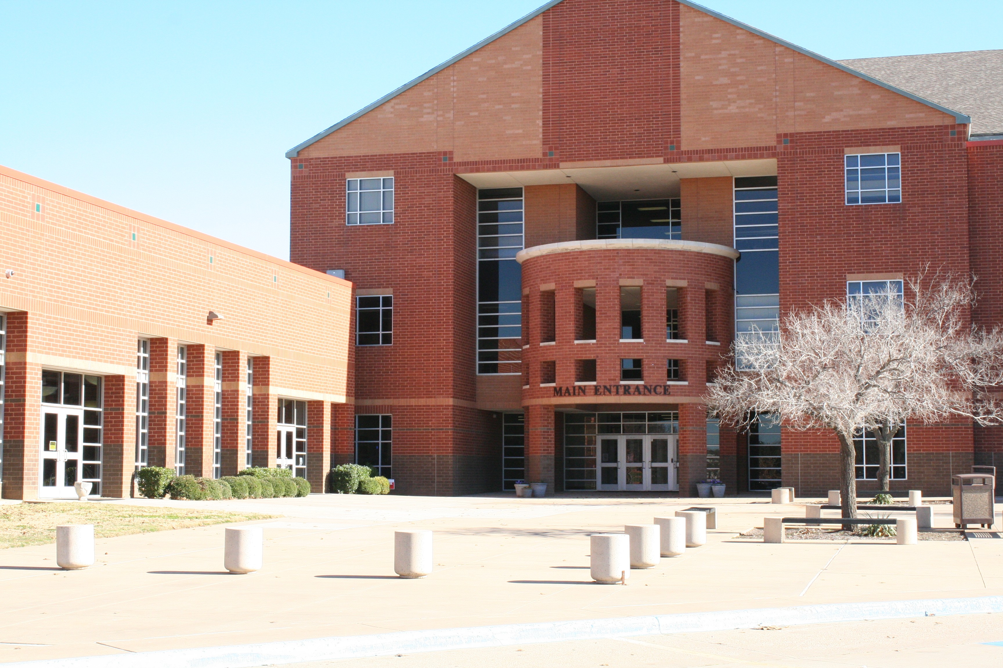 Red brick main entrance of Colleyville Heritage High School in Colleyville, Texas