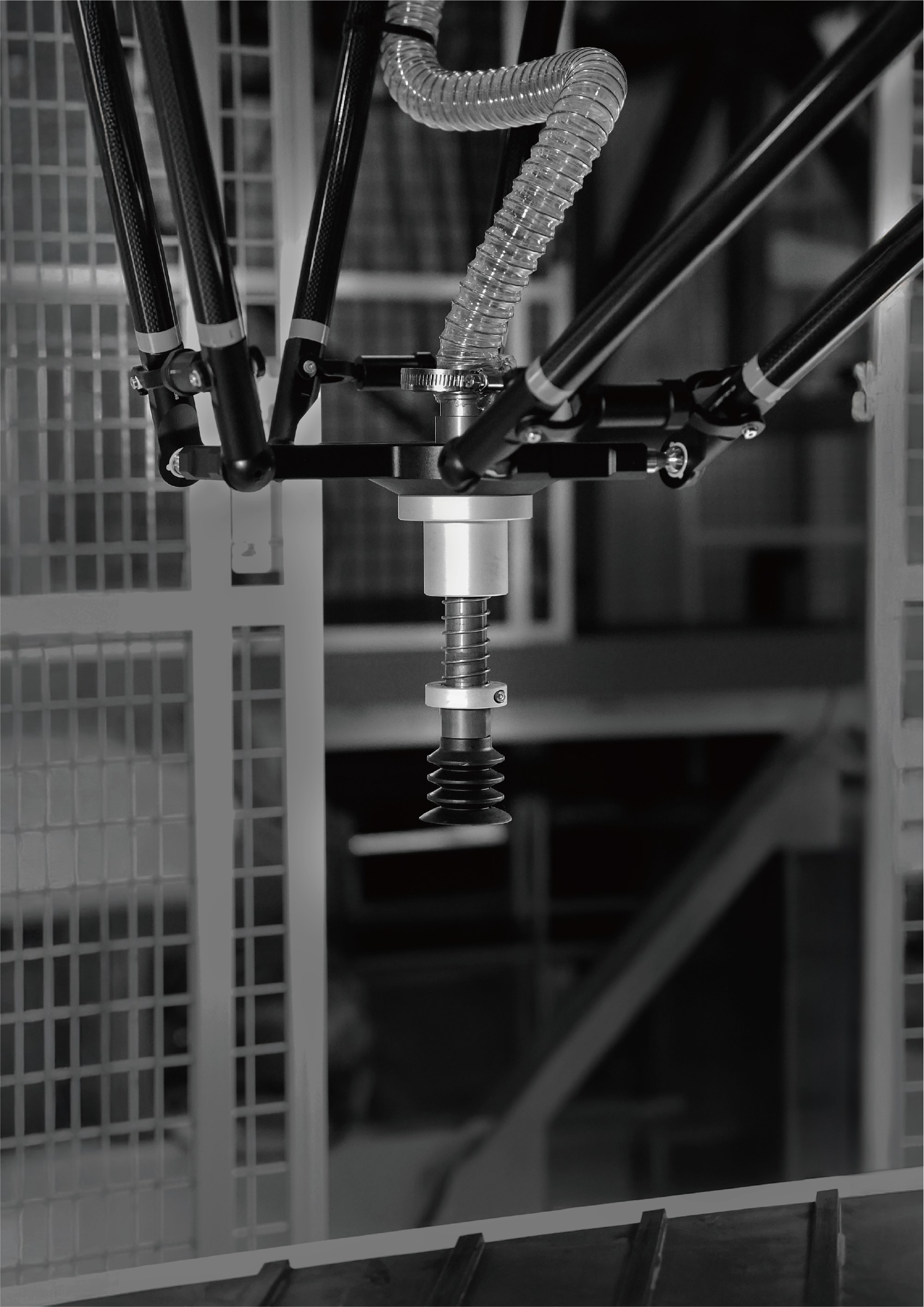 Atron robot arm with suction end effector operating on a sorting line