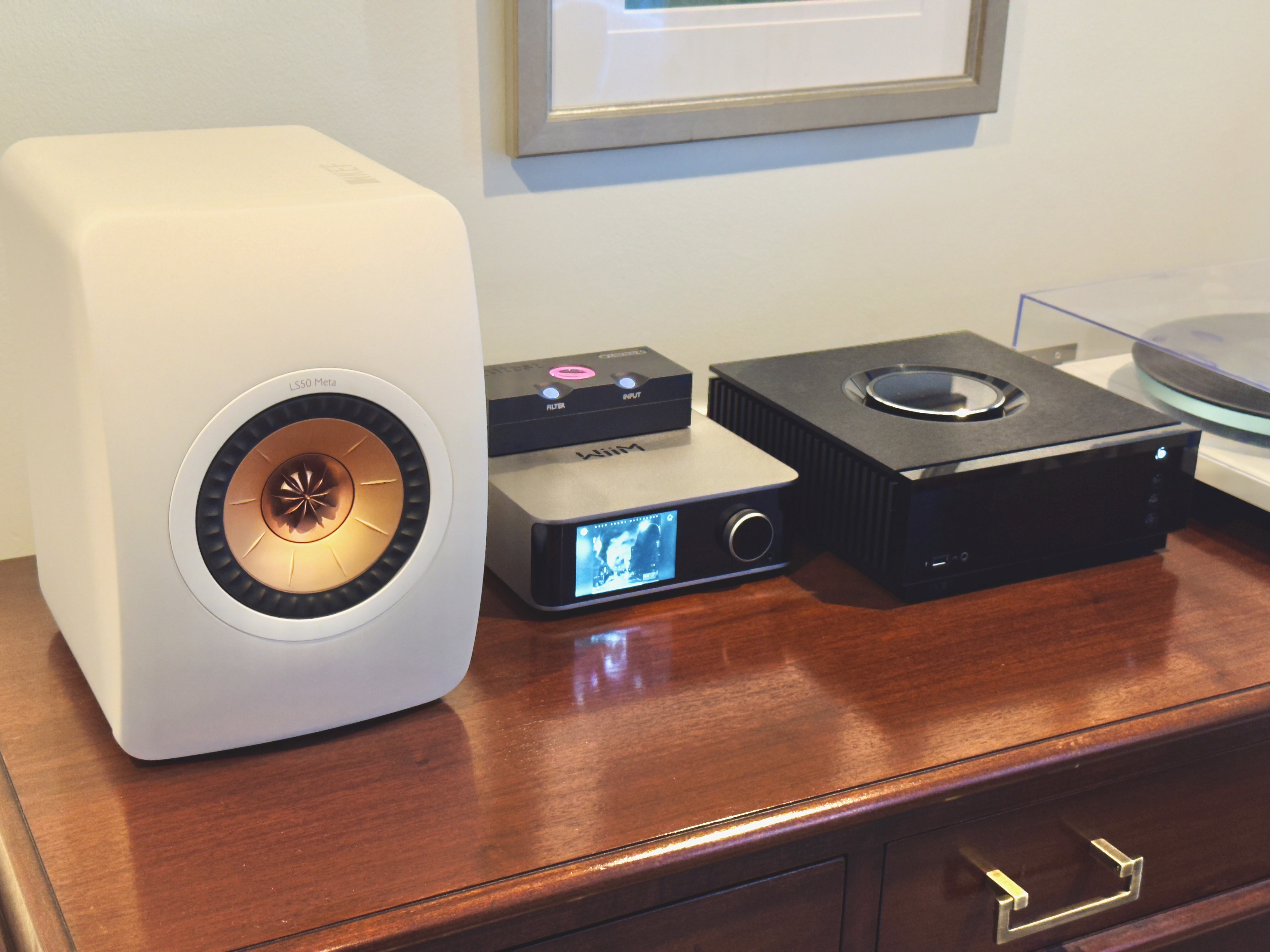 Wiim Ultra on a table with other audio components