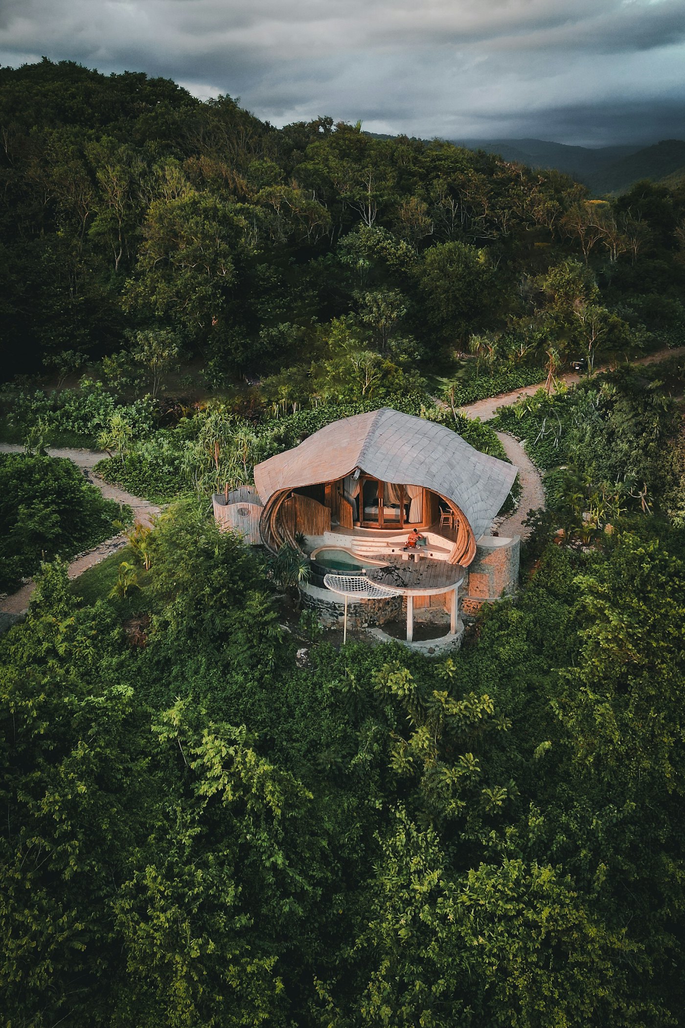 Contemporary bamboo architecture combining natural structure and sheltered interior space.