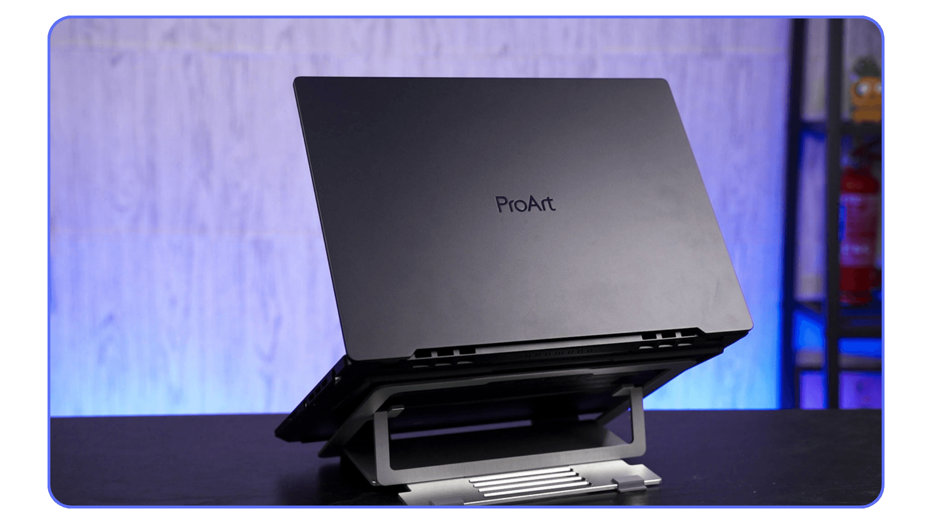 ASUS ProArt laptop elevated on a stand, designed for professional creative workflows