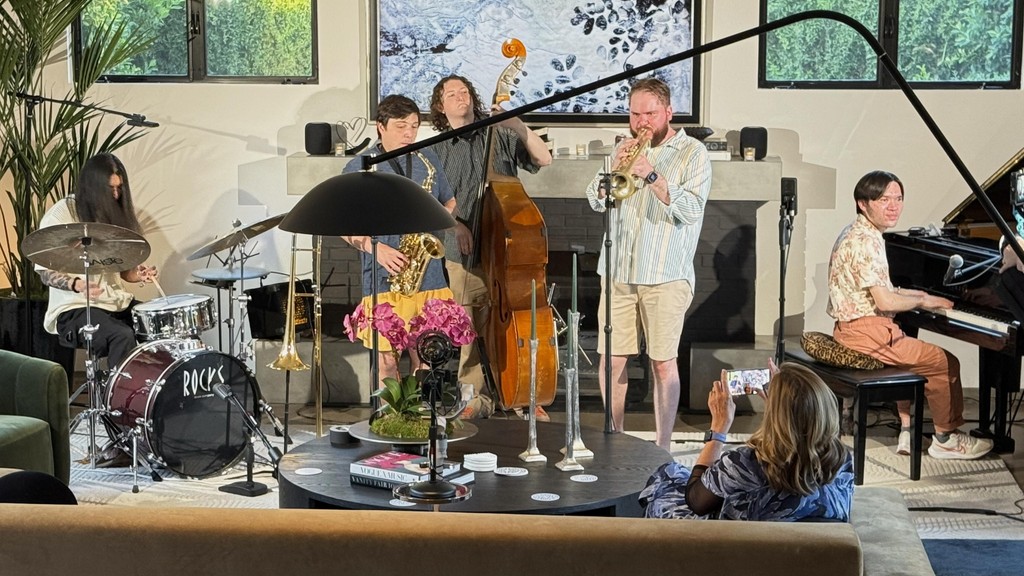 Alex playing trumpet with a jazz combo in his living room