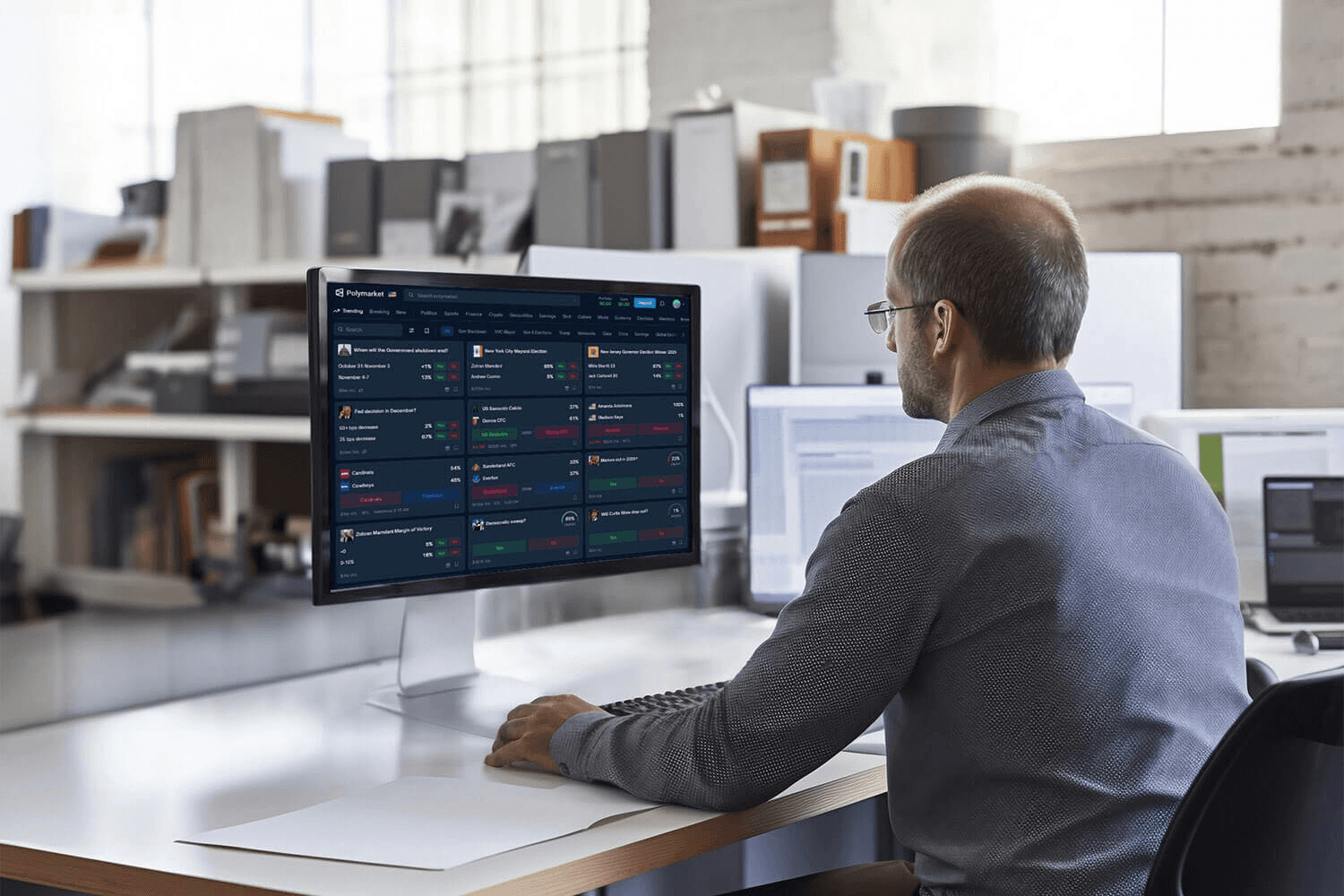 Man viewing Polymarket on computer - How To Withdraw From Polymarket