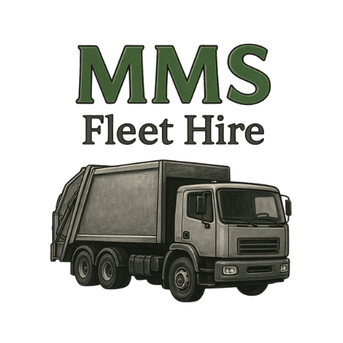 A young person with curly hair smiles at the camera while sitting in front of a laptop against a dark background.