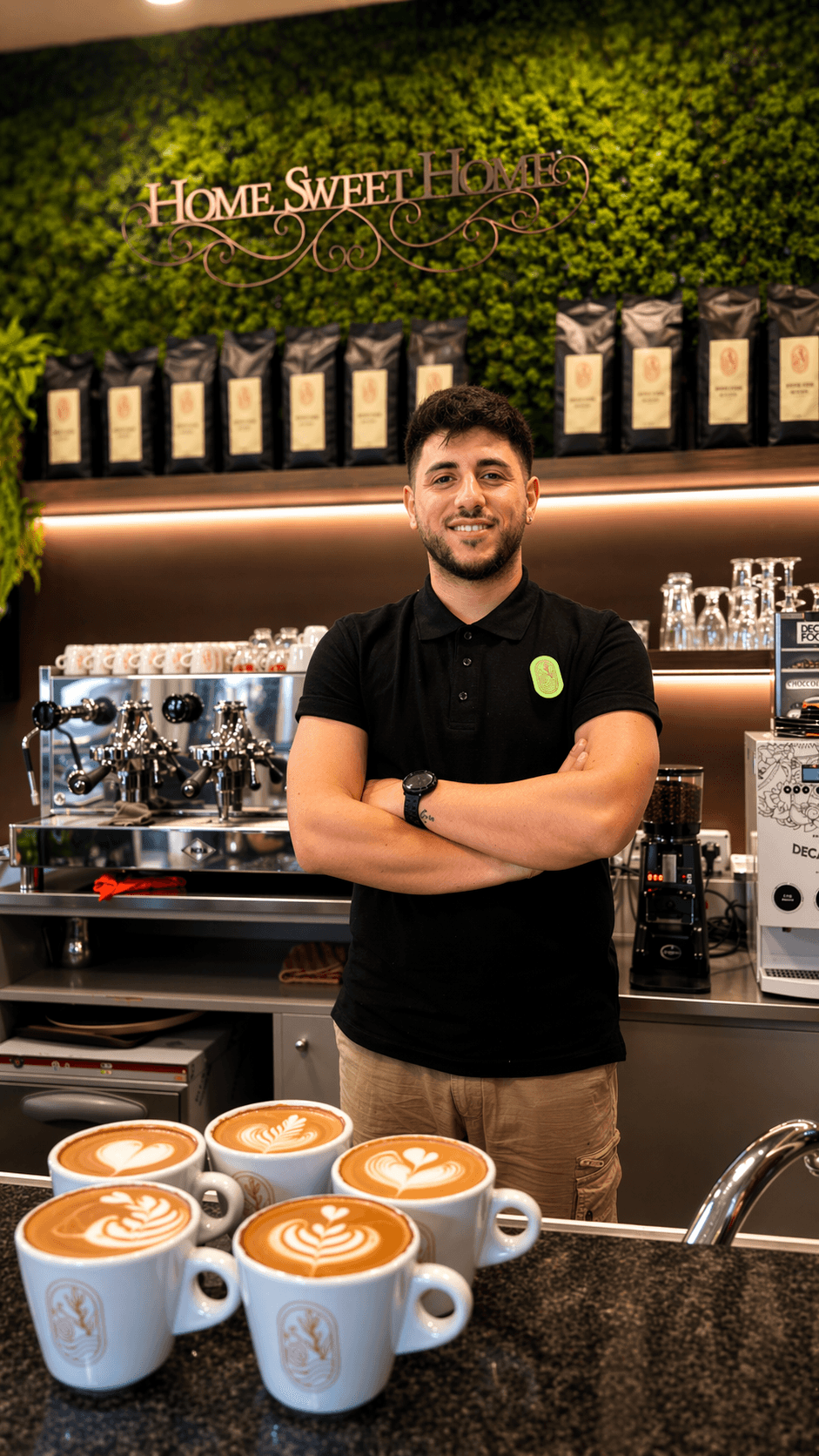 Barista in cafe pouring coffee