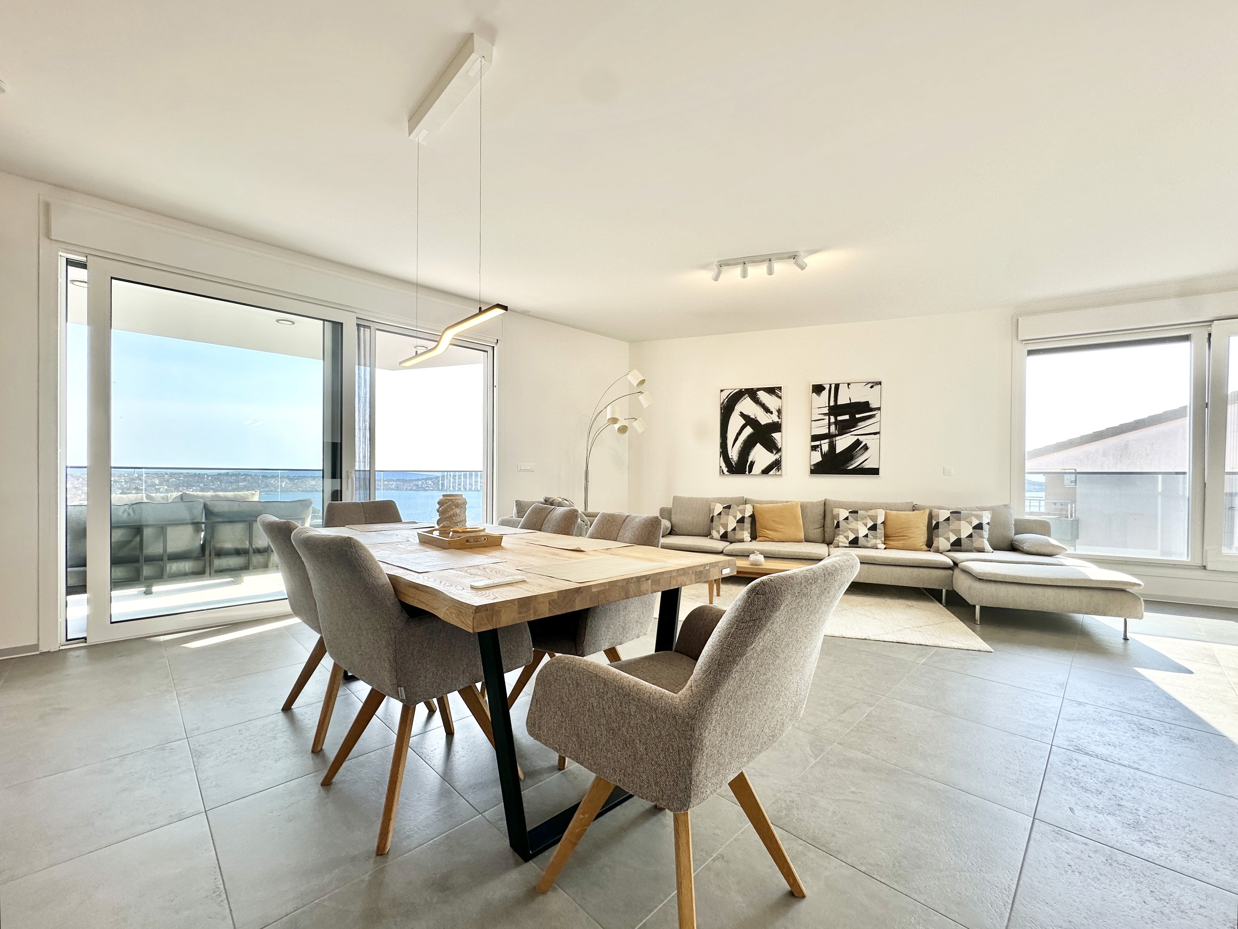 Ornate classic bathroom with claw-foot tub and wood paneling.
