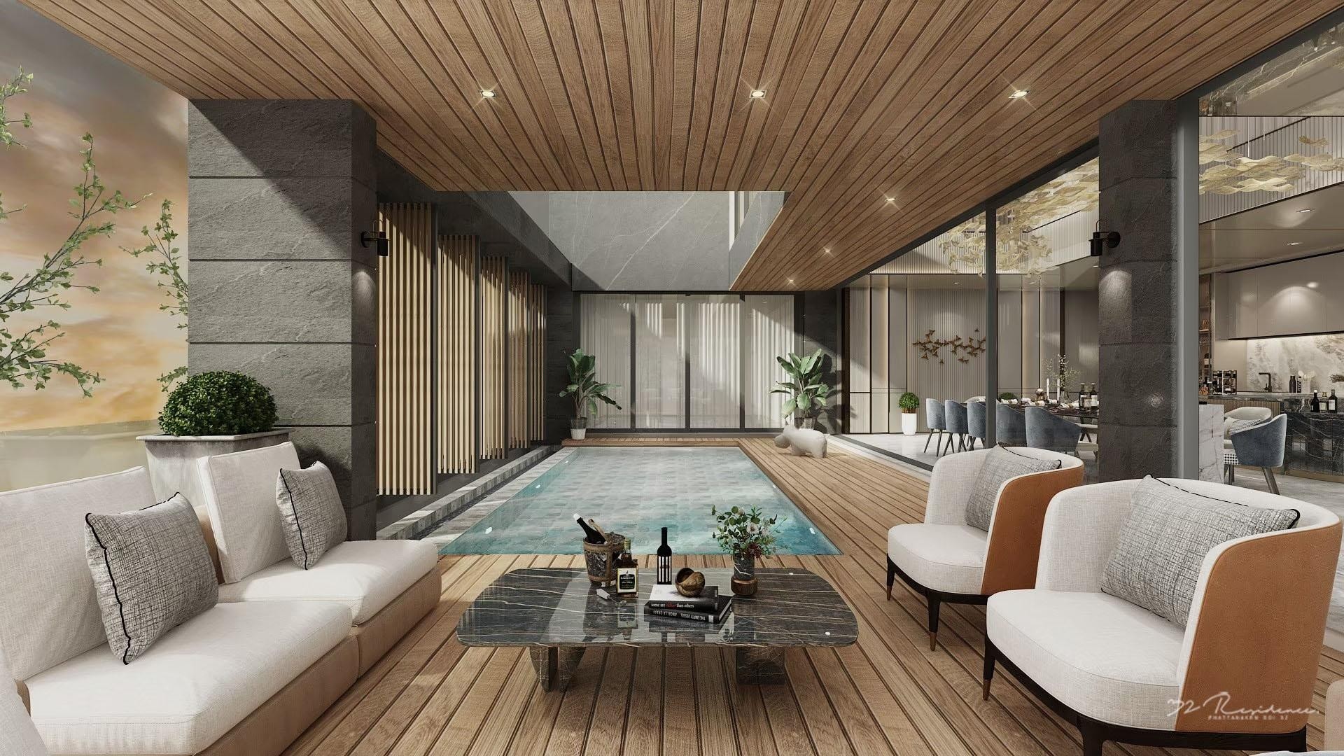 a person swimming in the water with grass