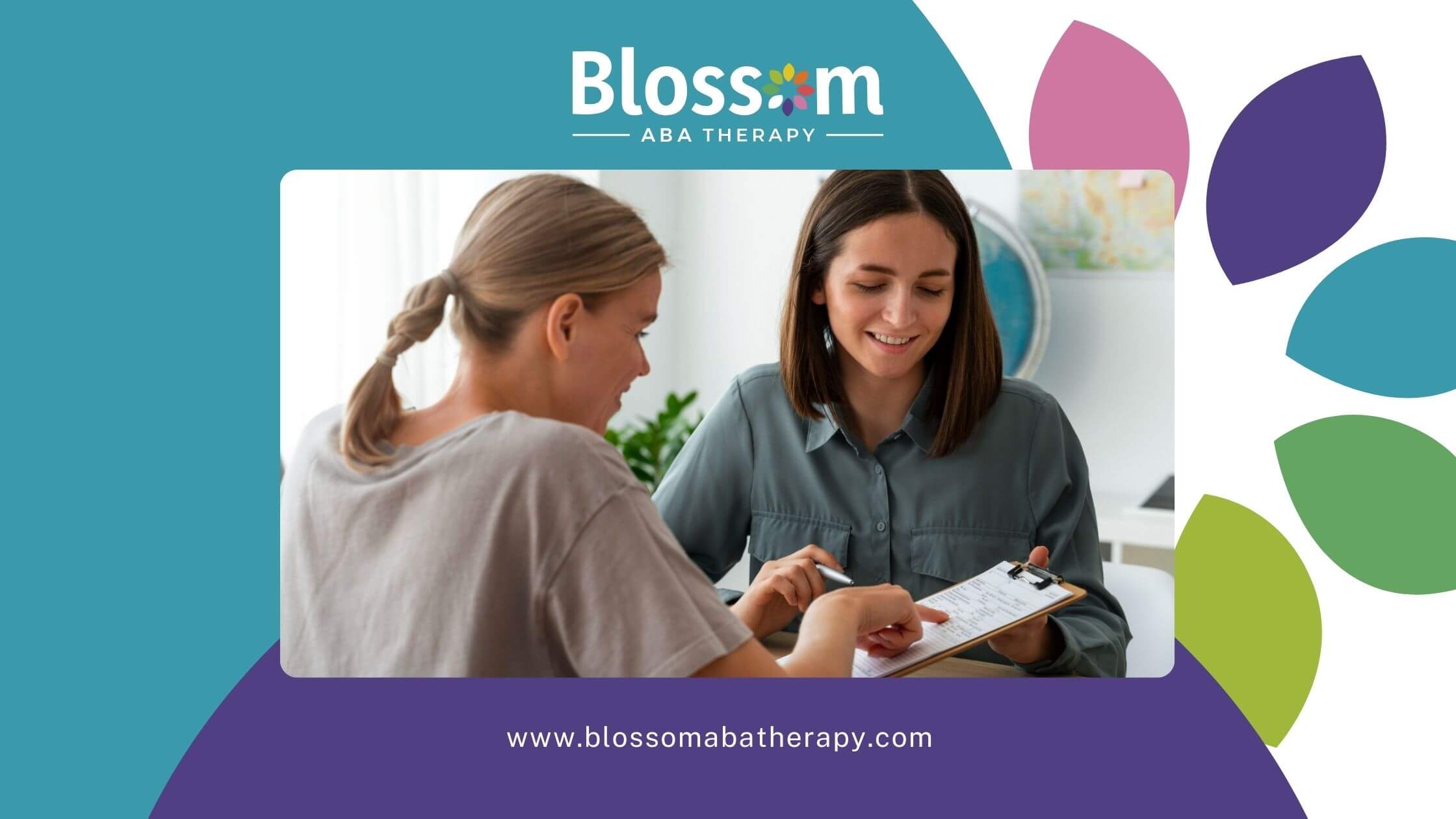 Two women sit at a table, smiling and looking at an FBA with one pointing at the paper.