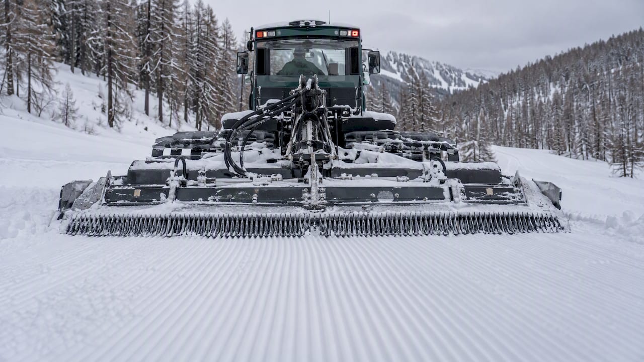 Snowcat tiller finishing a ribbed corduroy snow surface