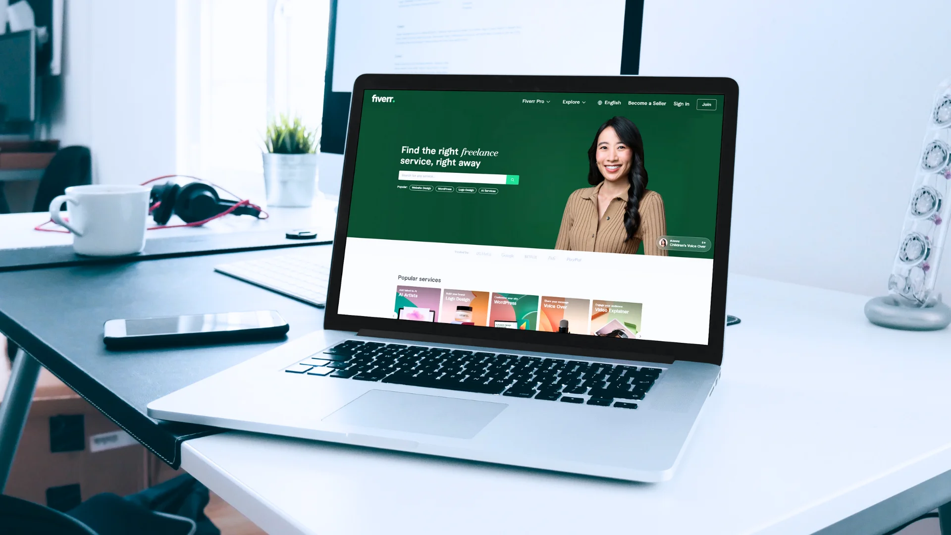 black video camera on brown wooden table