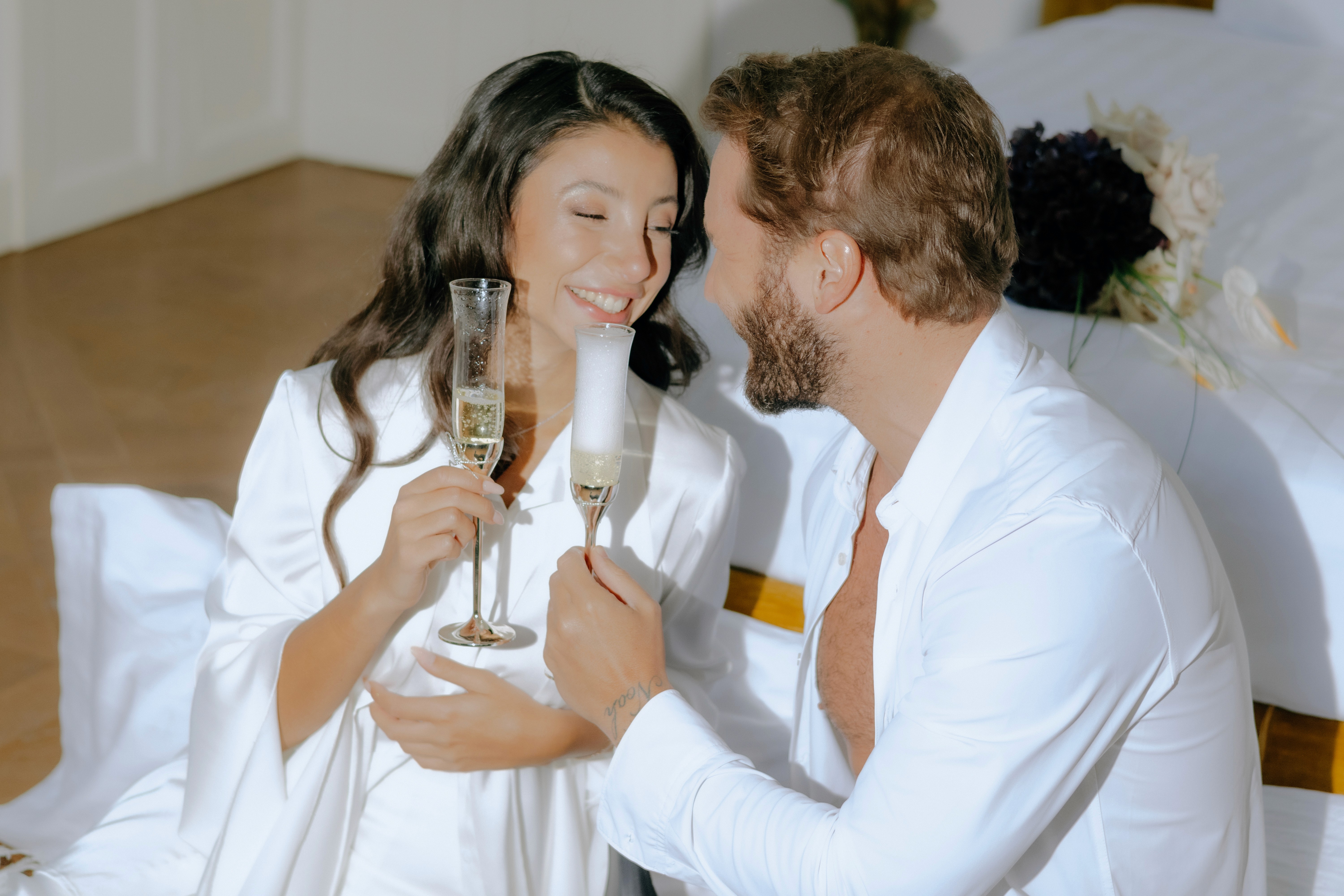 Stylish individual with platinum blonde hair, sunglasses, and leather outfit
