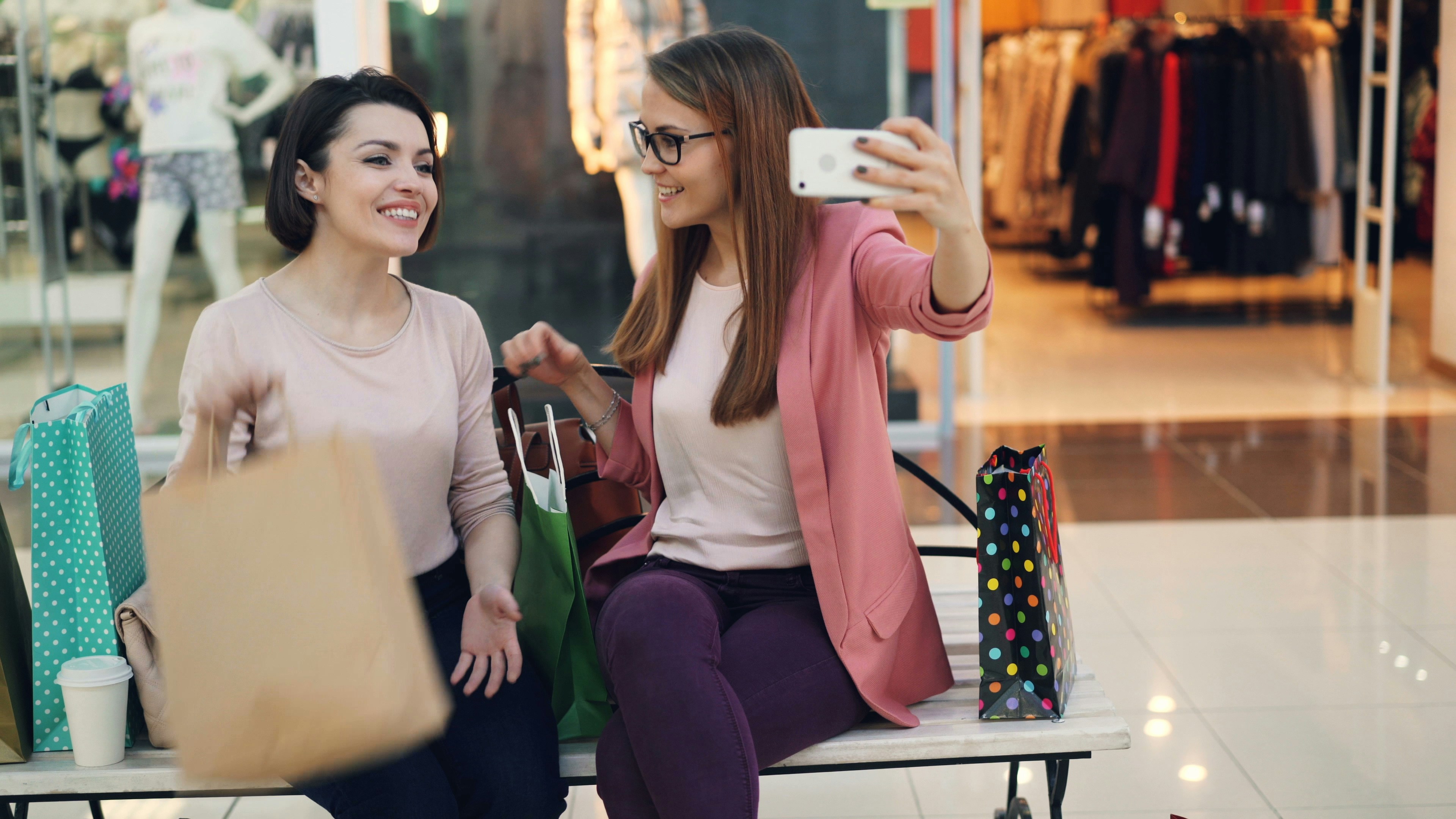 Two women taking a selfie while shopping