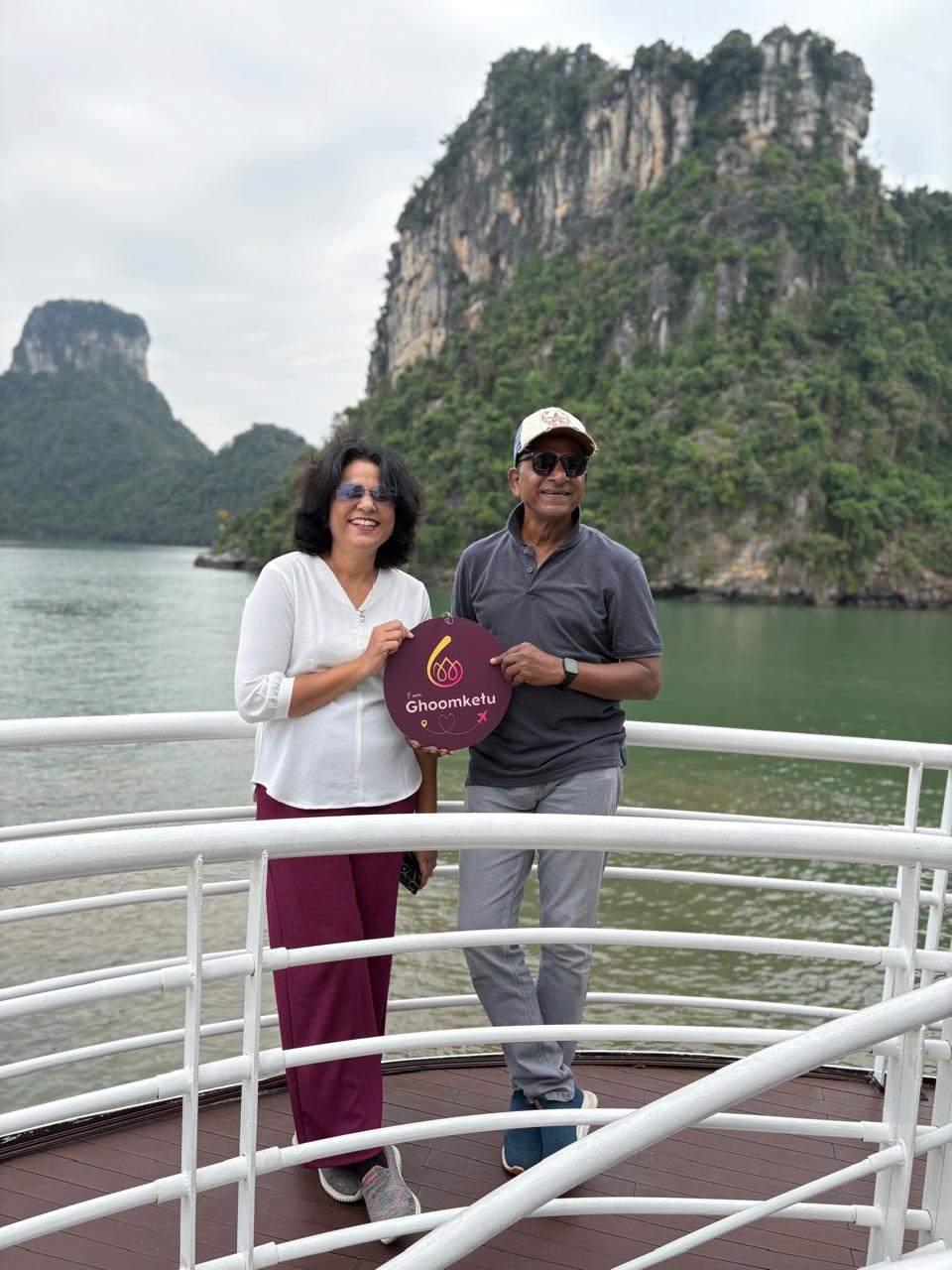train on bridge surrounded with trees at daytime