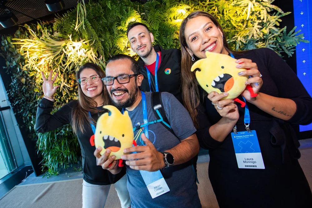 Attendees taking a photo with their Firebase plushies