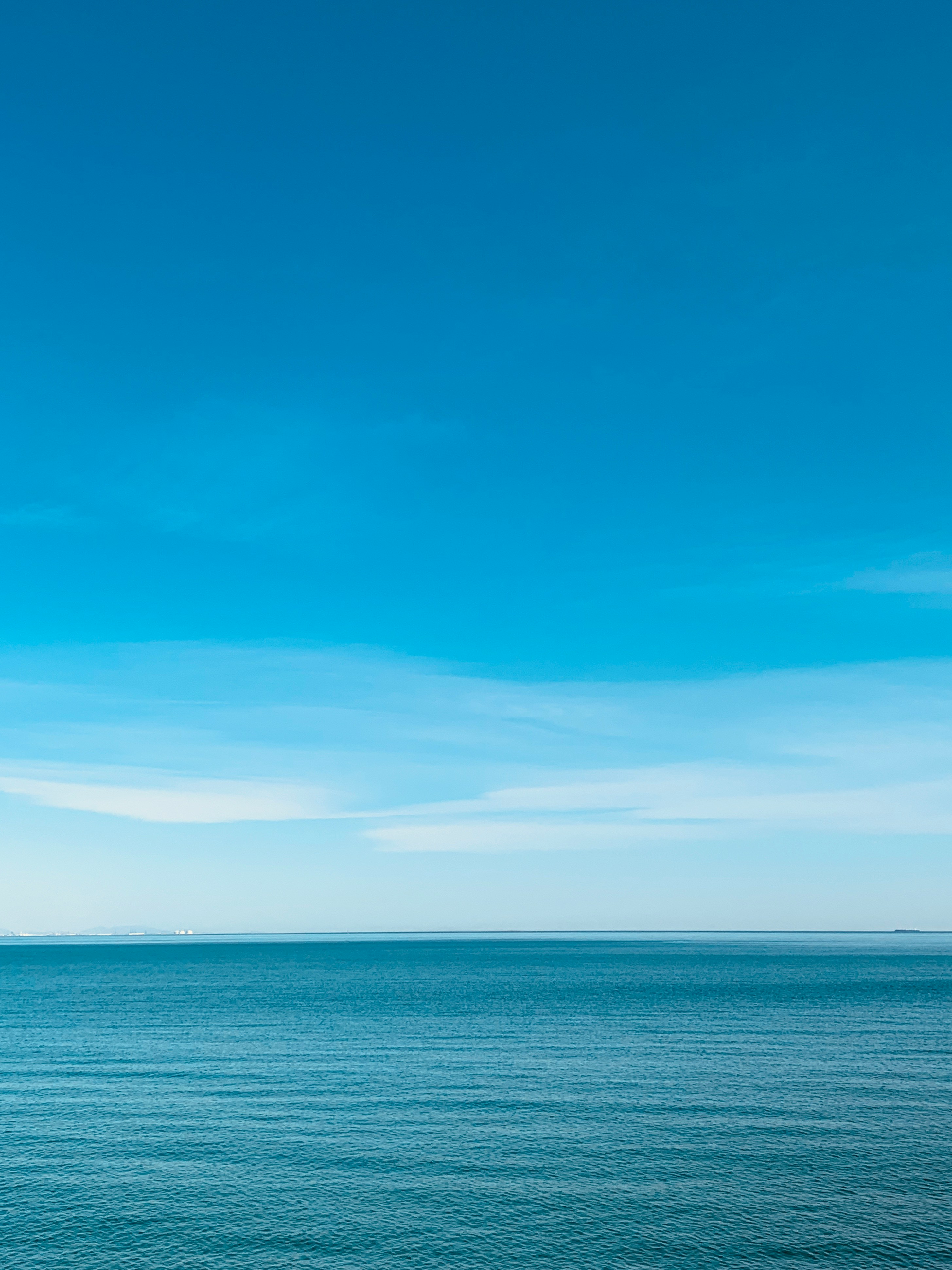 blue sea under blue sky during daytime