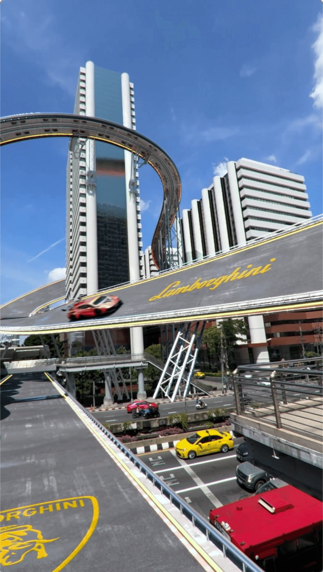 A sleek orange Lamborghini racing on a futuristic elevated track through a modern city