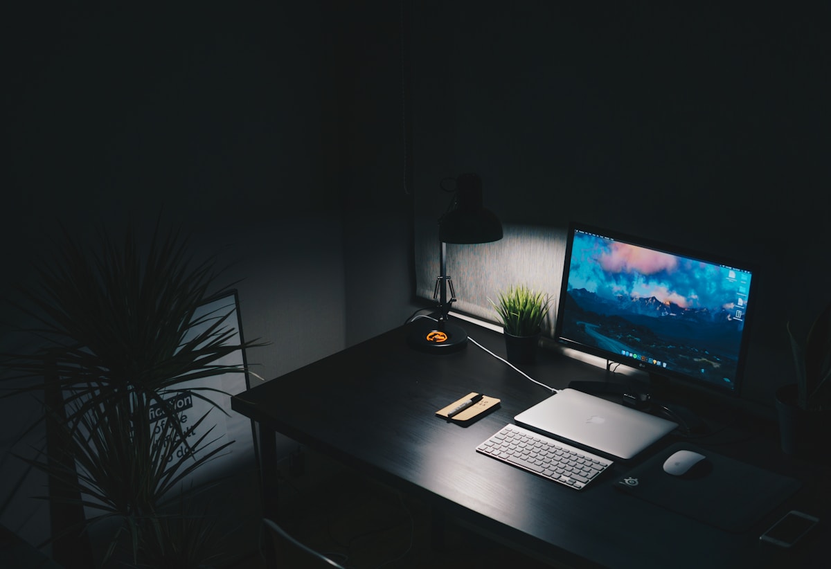Desk with a monitor and keyboard set up for remote work