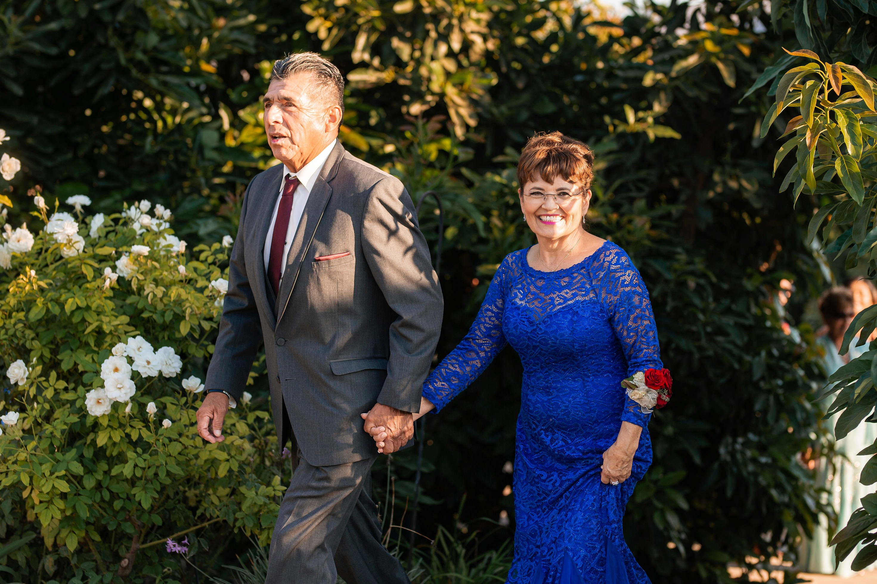 Flat lay wedding details with bouquet, rings, and sparkling bridal heels