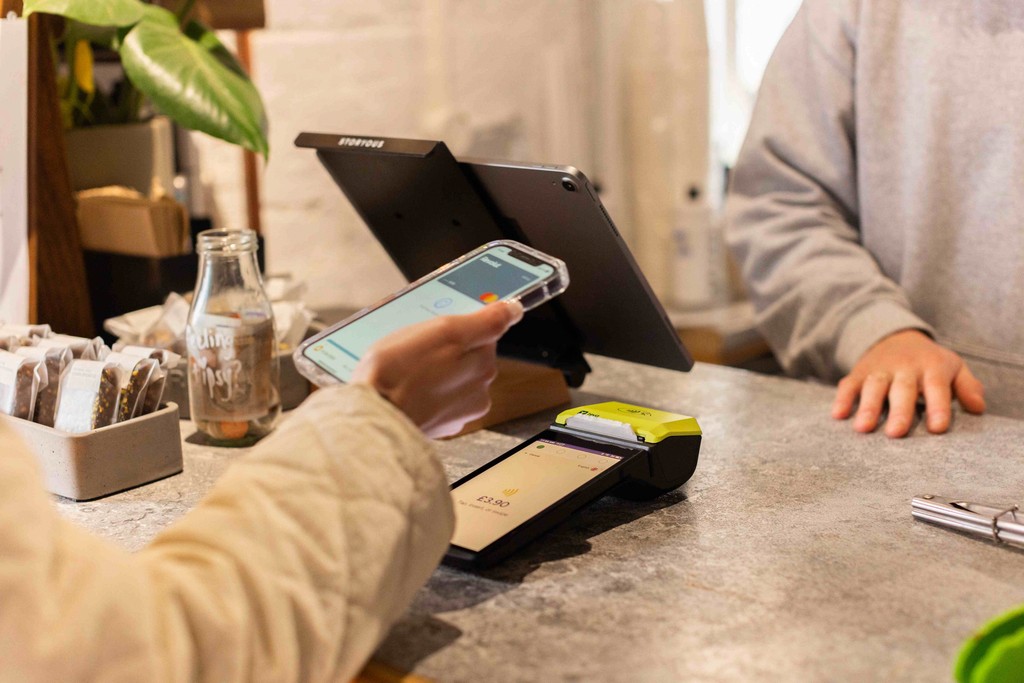 a customer completes a credit card payment in a shop using a Teya card machine